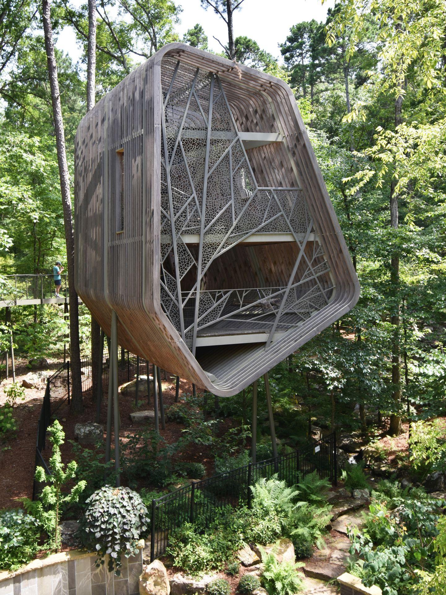 A unique treehouse inside of Garvan Woodland Gardens. The treehouse has an organic shape and there is a geometric design on the exterior.