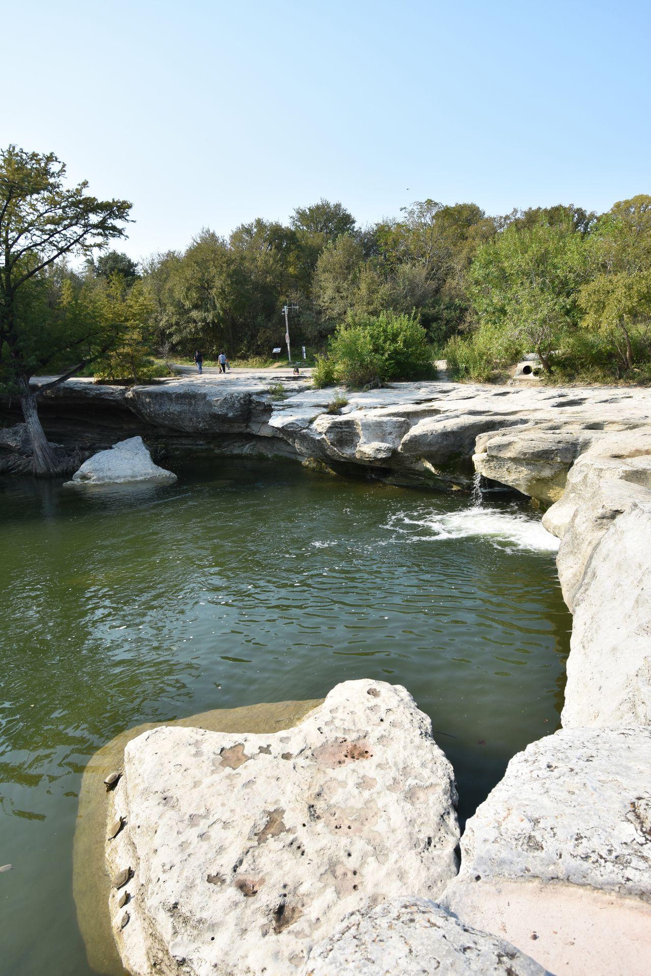 A rock wall with water underneath at McKinney Falls State Park