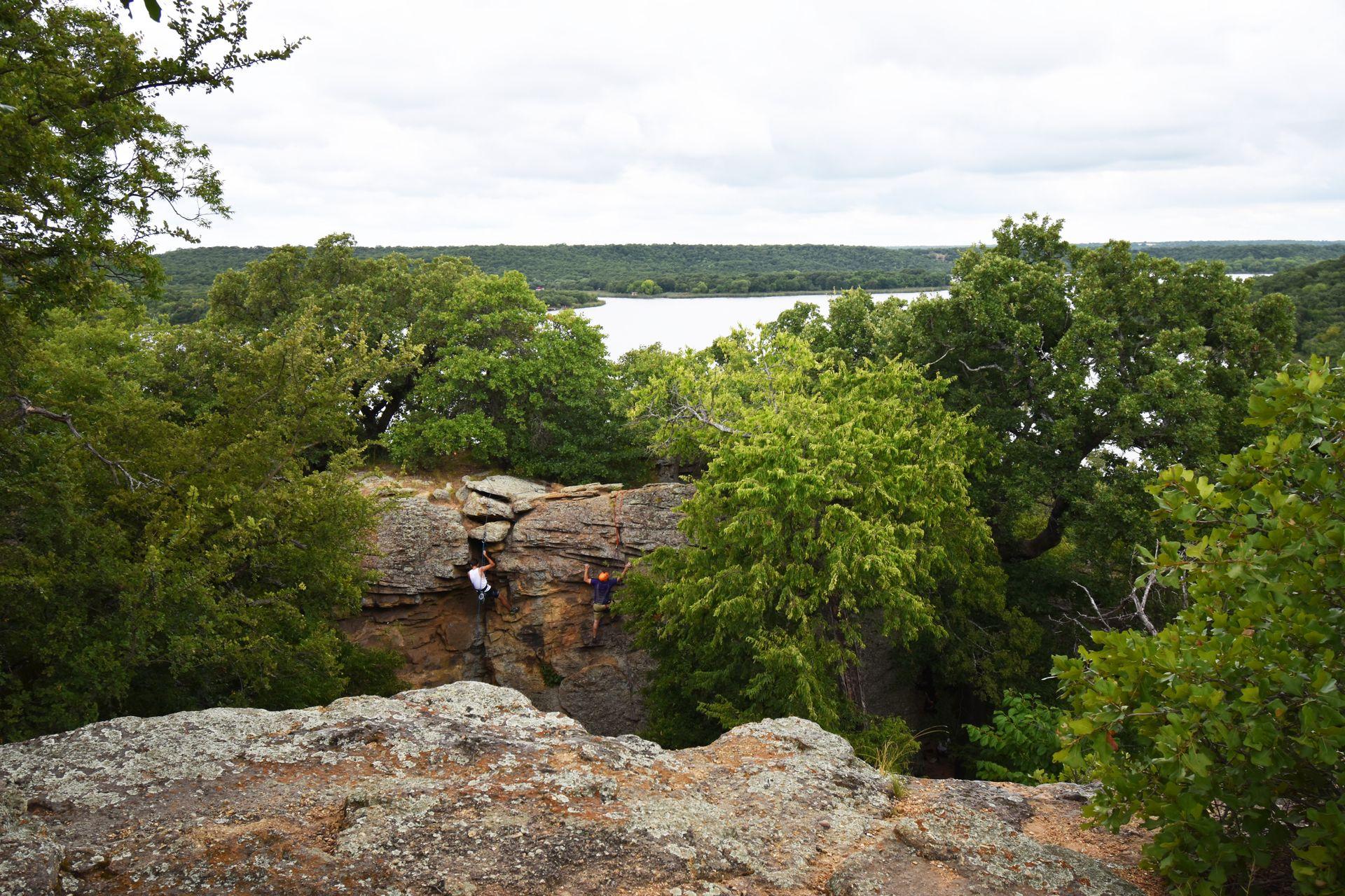 Some rock climbers on a rock wall at Lake Mineral Wells.