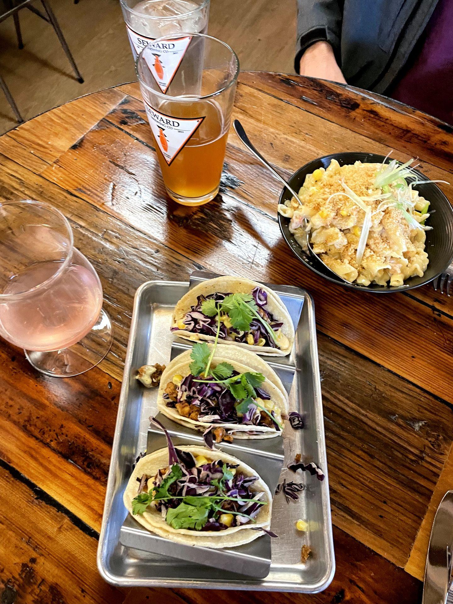 Plates of tacos and mac and cheese from the Seward Brewing Company.