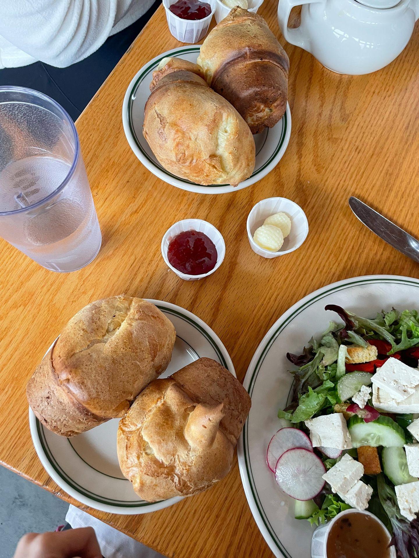 Two plates of popovers and a salad from Jordan Pond House