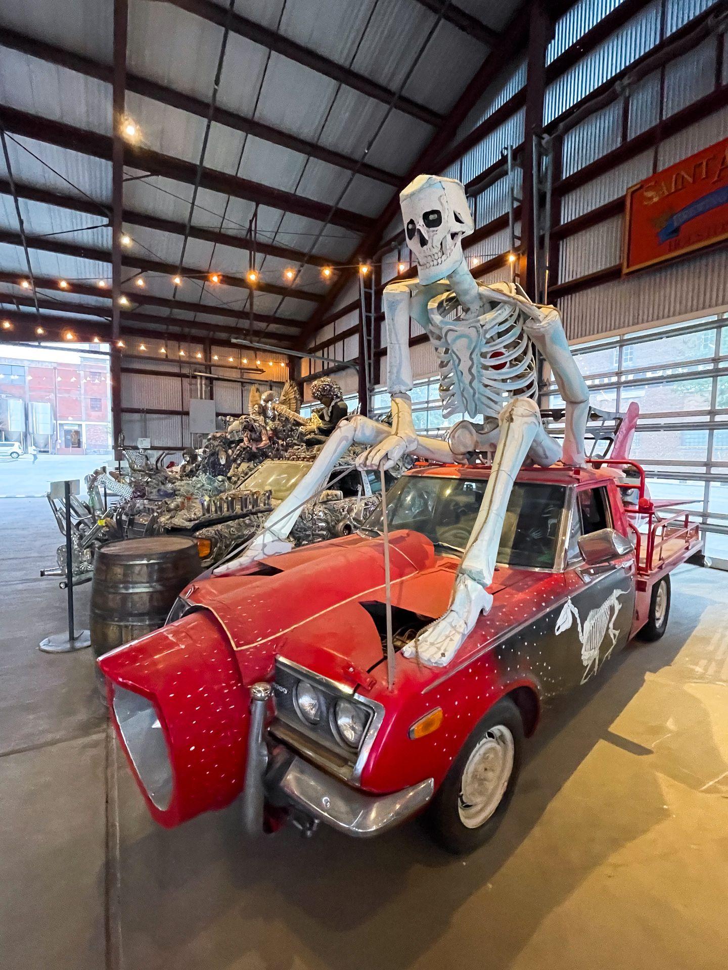 A giant skeleton on top of an Art Car at Saint Arnold Brewing Company