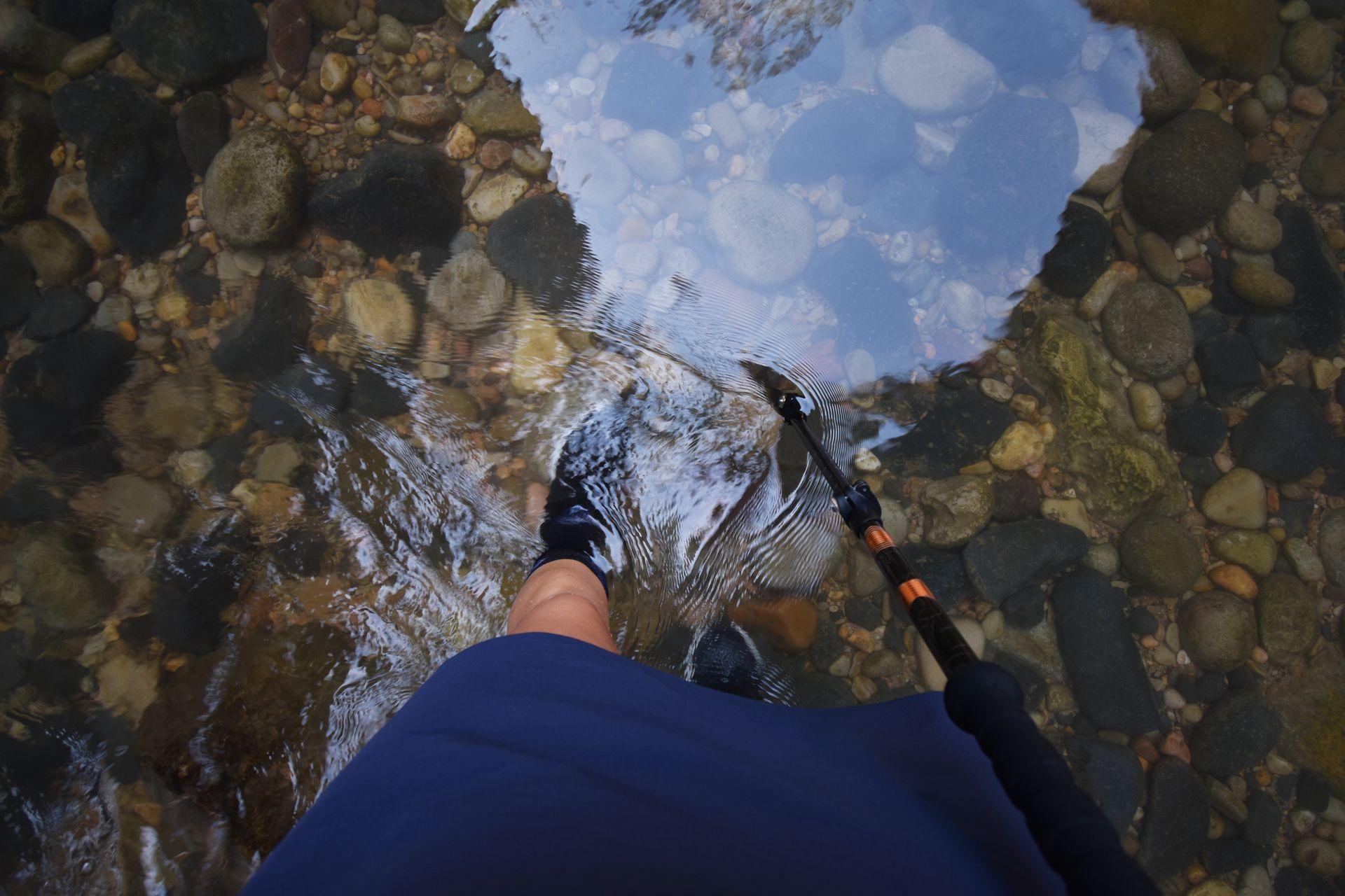 Looking down at Lydia's feet in the water during the Narrows hike.
