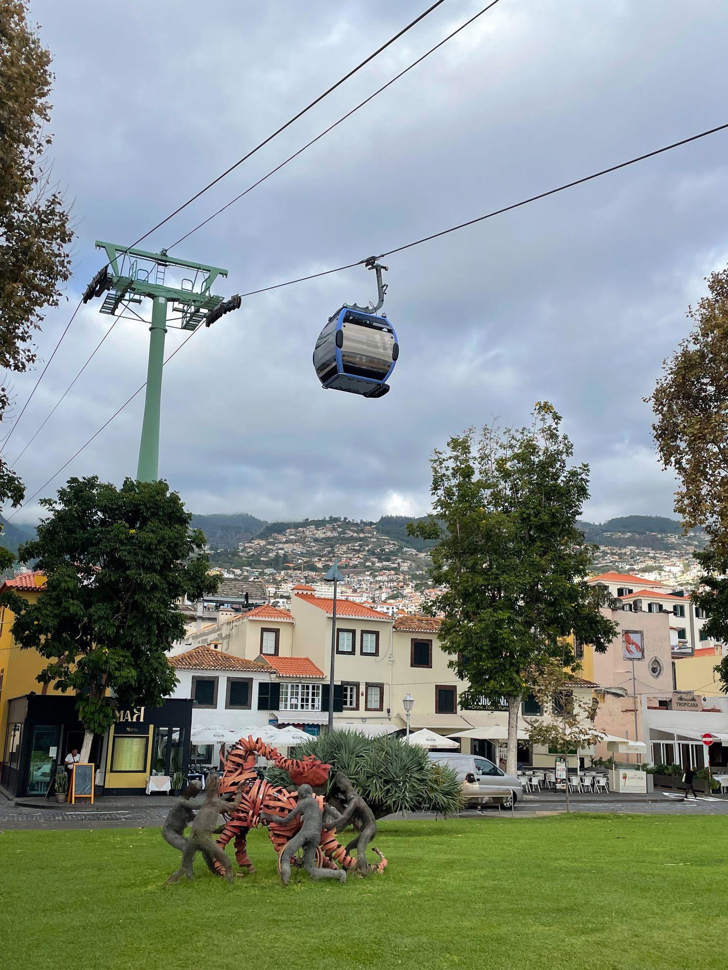 Looking up at a cable car going by in Funchal