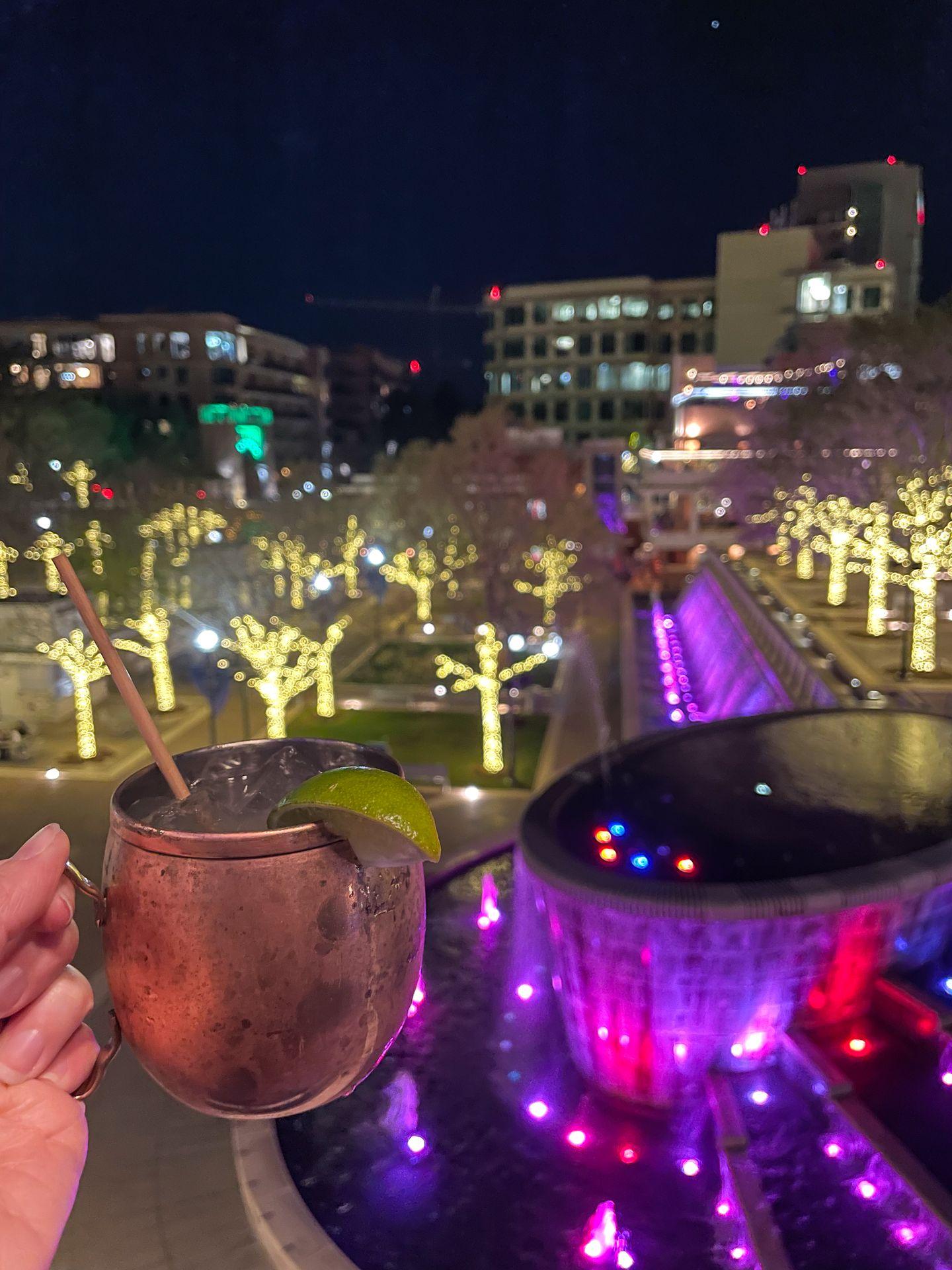 Holding up a moscow mule on the outdoor patio of Como Social Club