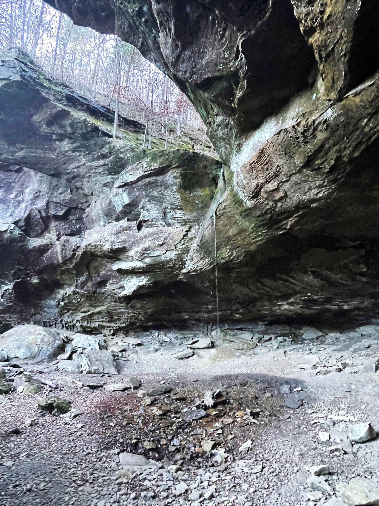 A view of Pam's Grotto with a light trickle of water falling down from above.