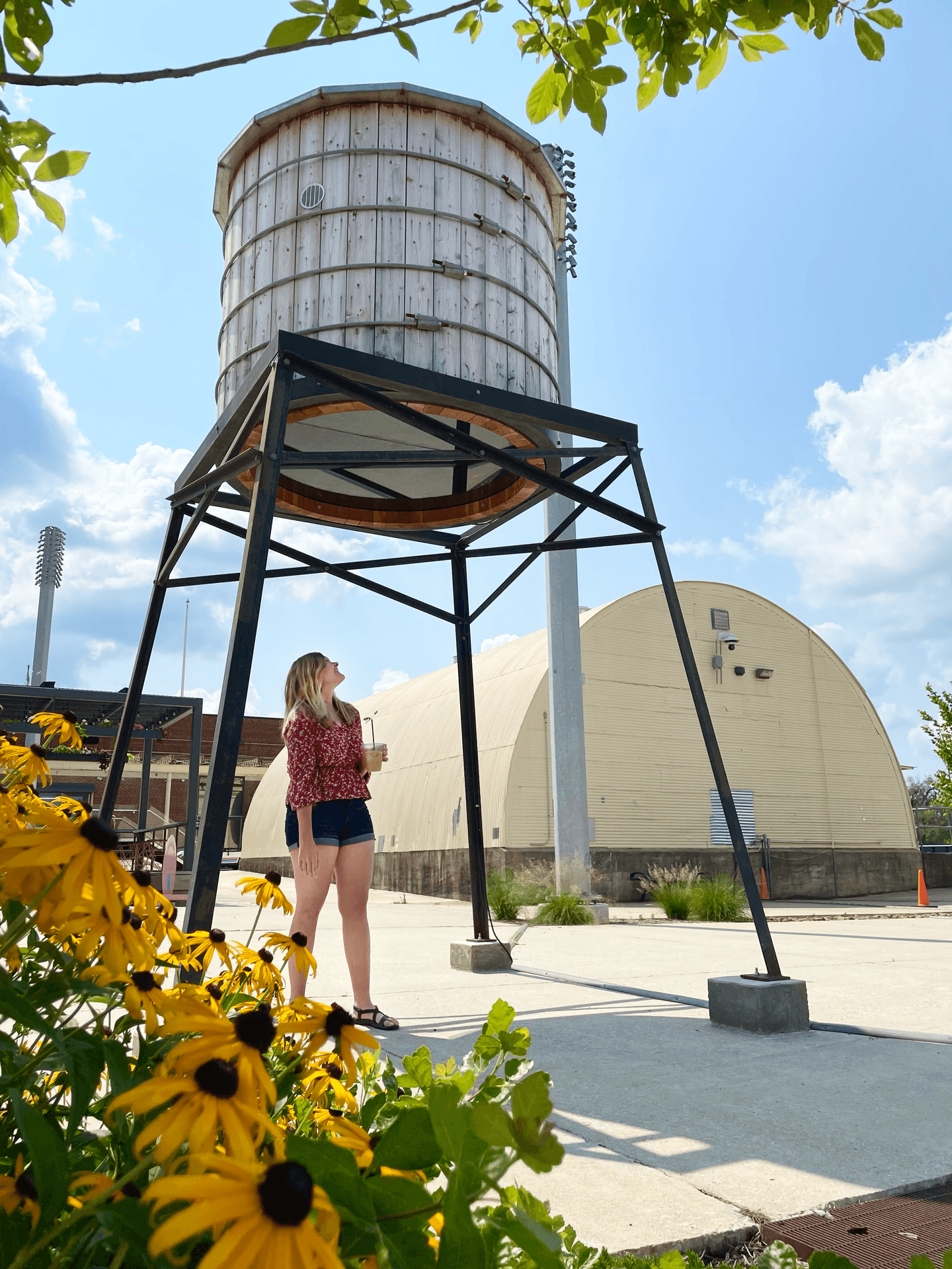 Lydia standing under a silo outside of the Momentary