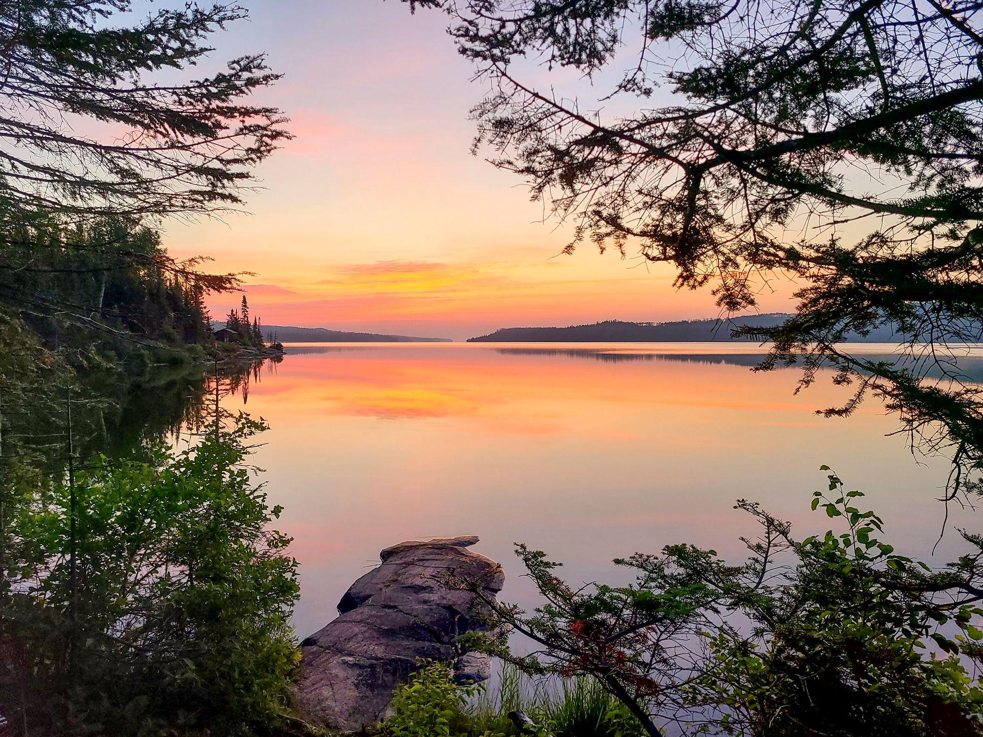 A view of sunrise over Lake Superior from a campsite in Isle Royale National Park