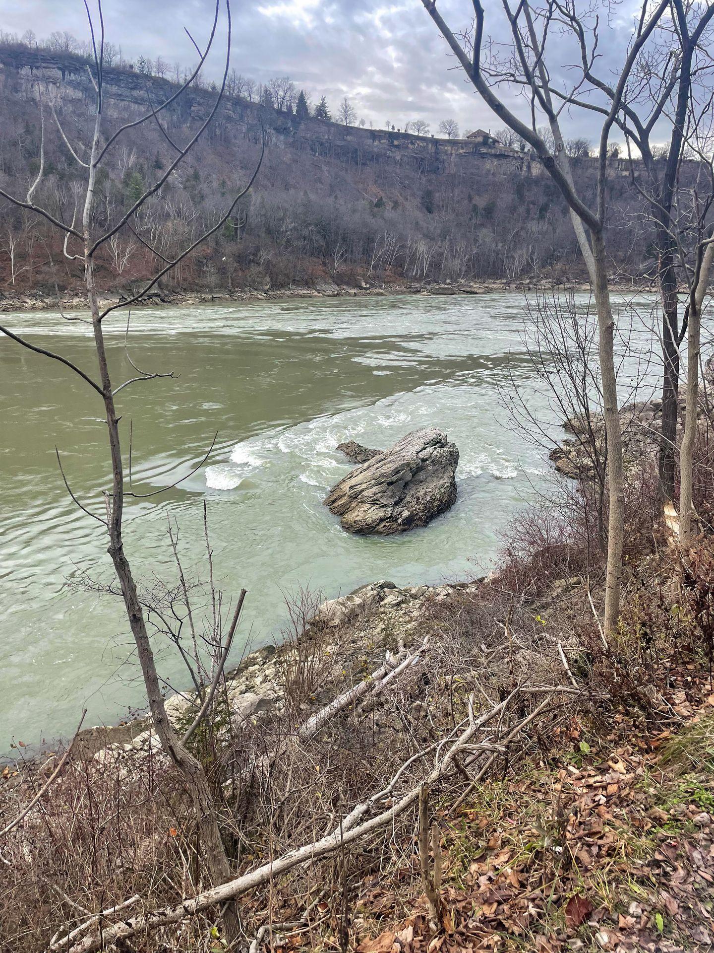 A wide river seen along the trail at Devil's Hole State Park.