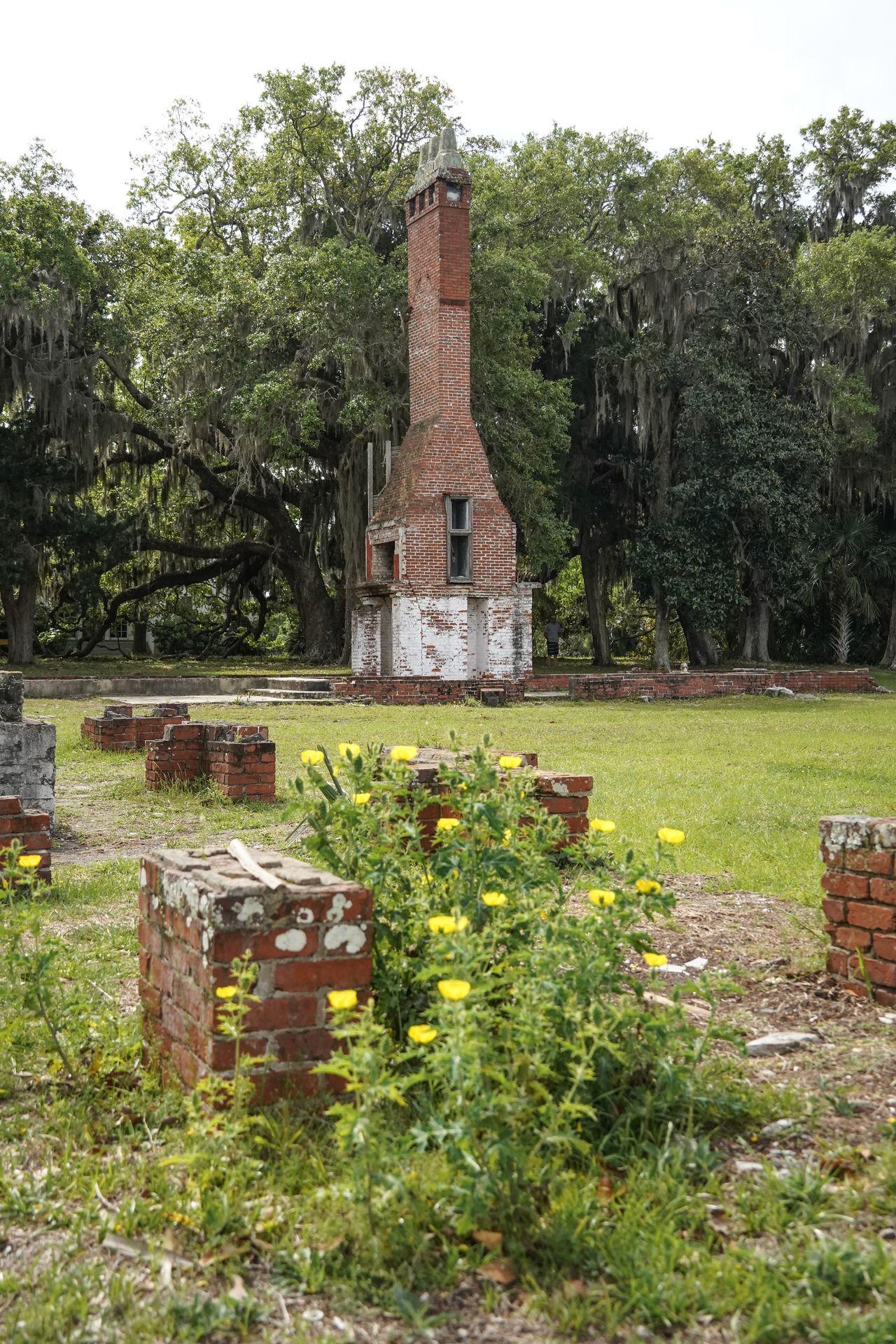 A brick chimney and bits of foundation from the Dungeness Mansion on Cumberland Island