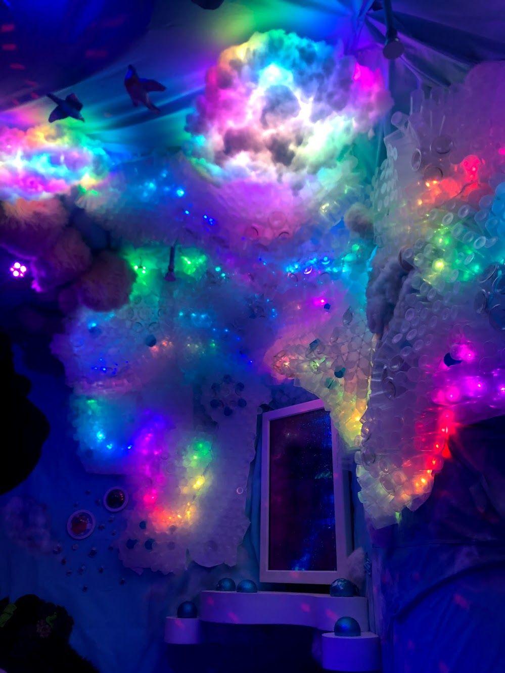 Rainbow lights in glowing clouds inside of Factory Obscura in Oklahoma City.