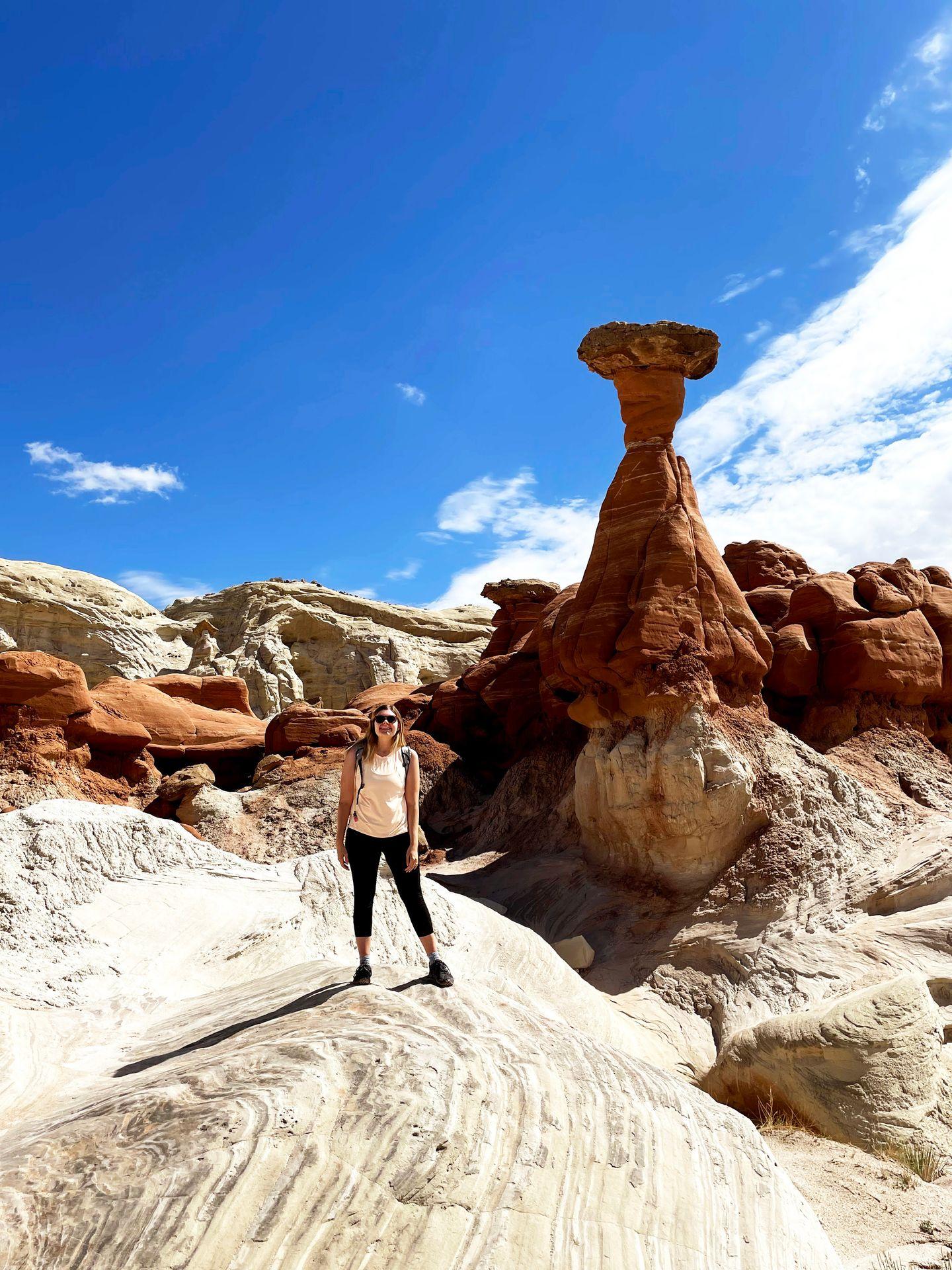 Lydia standing with hoodoos behind her.