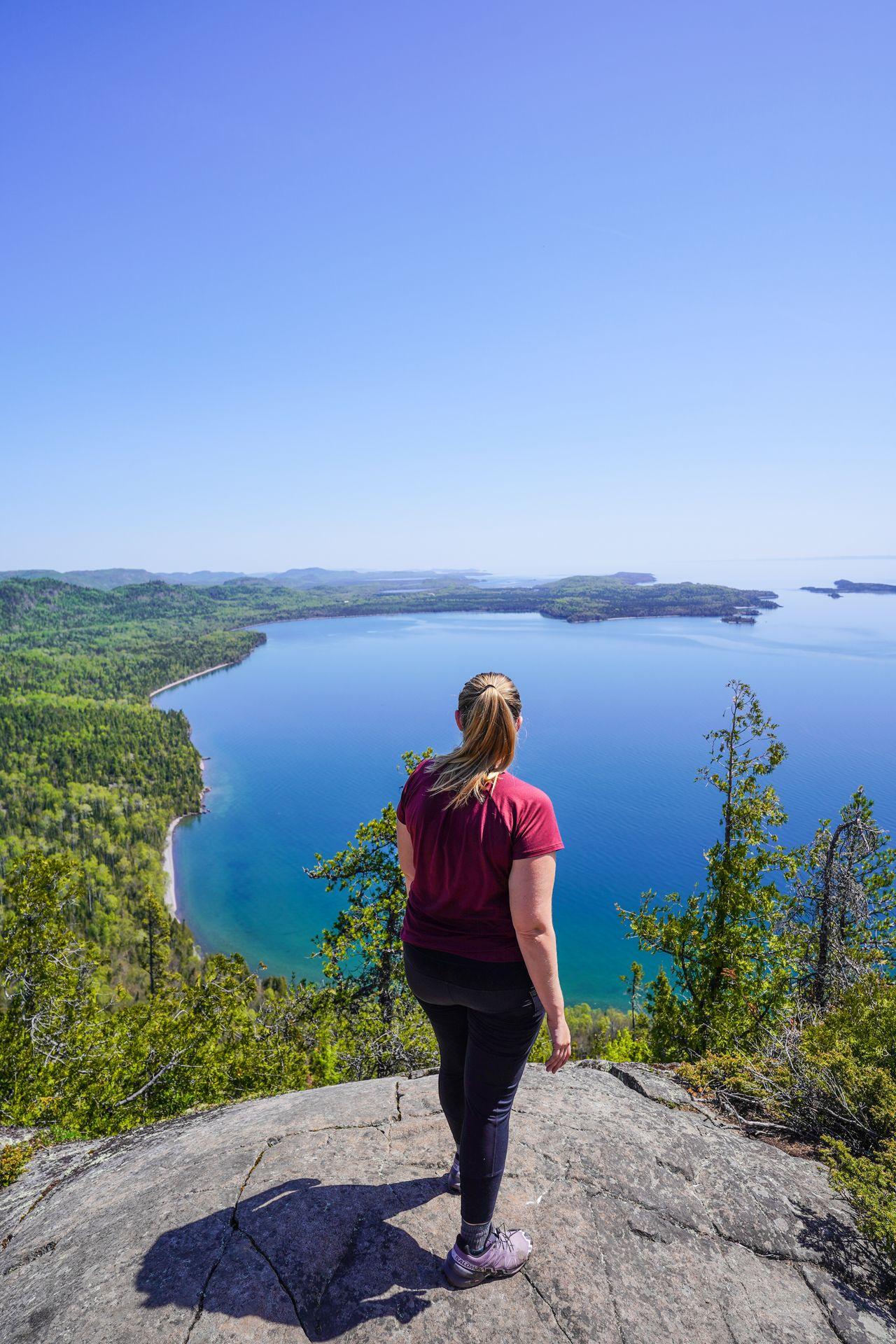 Lydia looking out at Lake Superior from the top of Mount Josephine