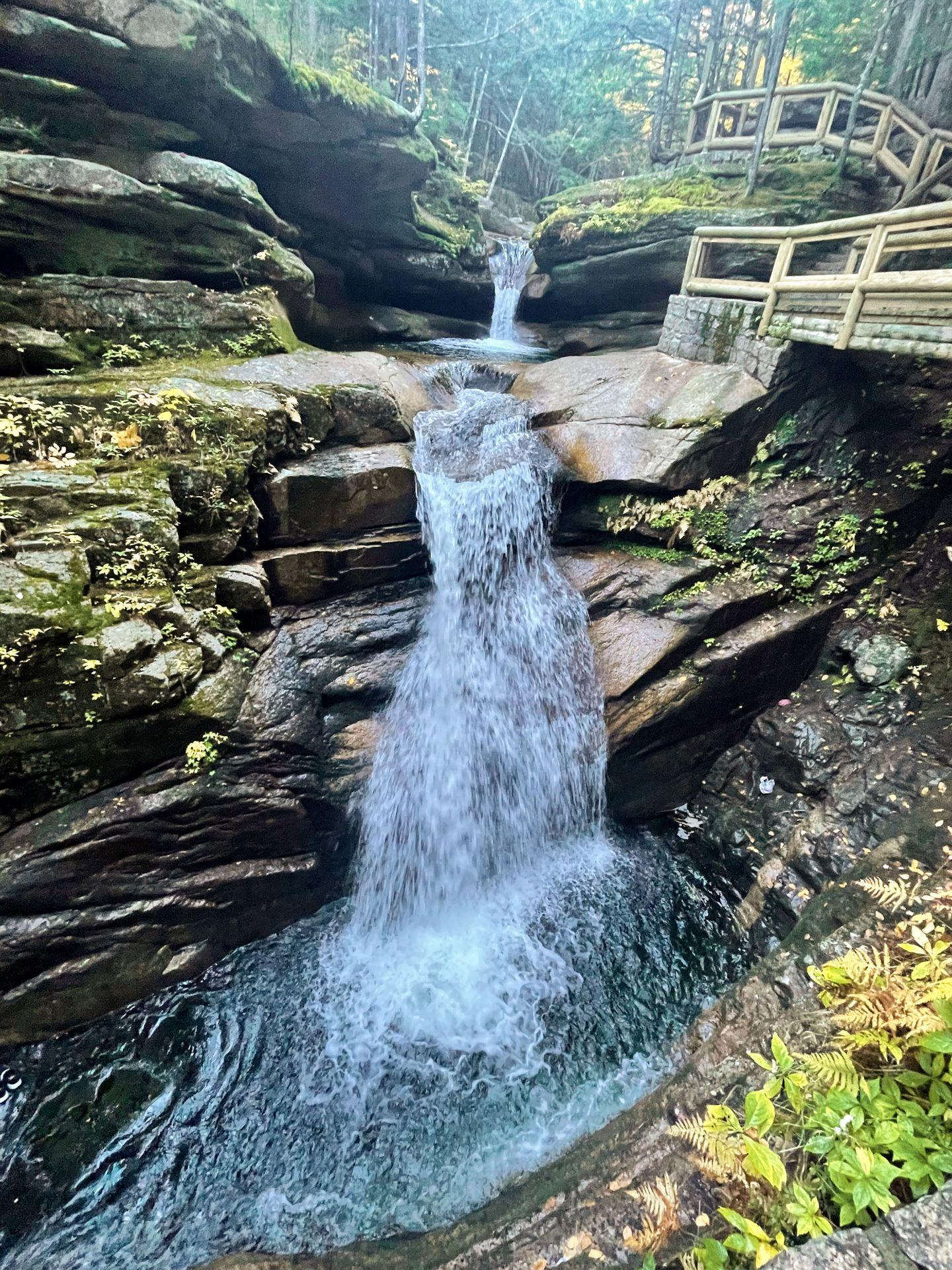 Looking down at the Sabbaday Waterfall. The water cascades down rocks.