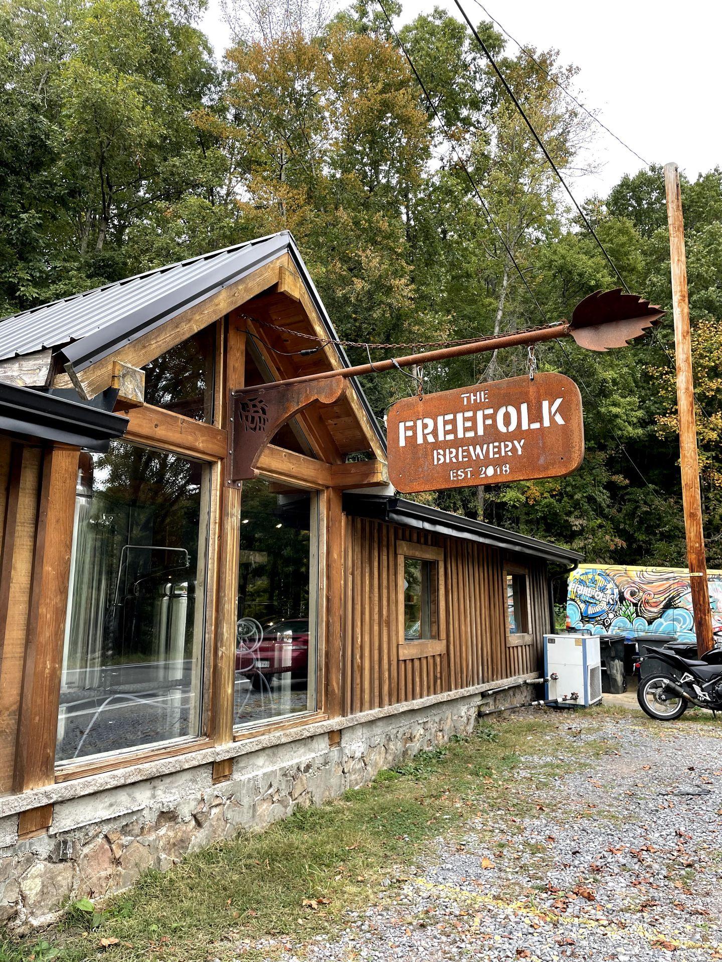 The exterior of Freefolk Brewery. The building is brown with large windows.