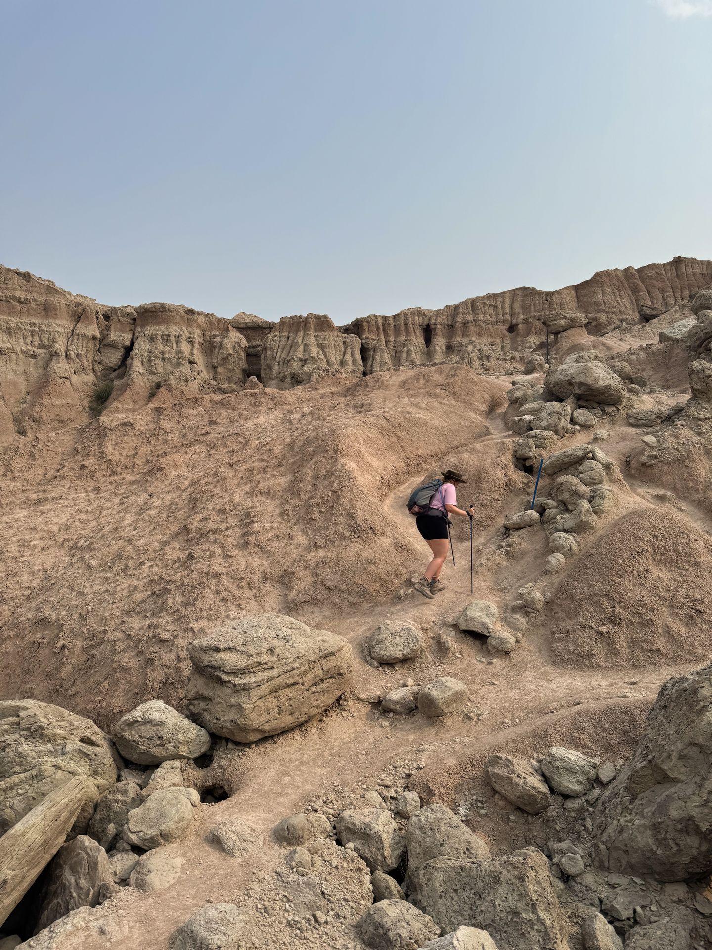 Lydia climbing a steep, narrow trail on the Saddle Pass Trail