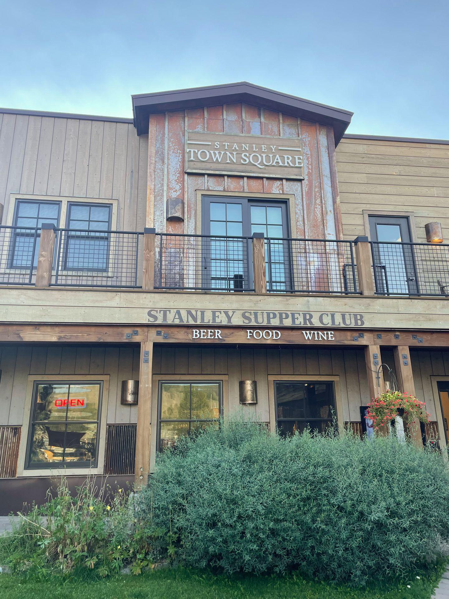 The exterior of Stanley Supper Club. Above the name of the restaurant, it reads Stanley Town Square.