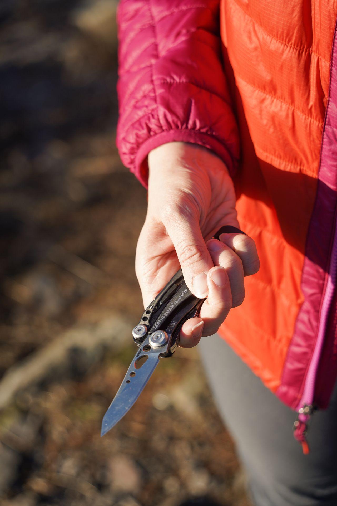Holding up a knife in the Leatherman Skeletool