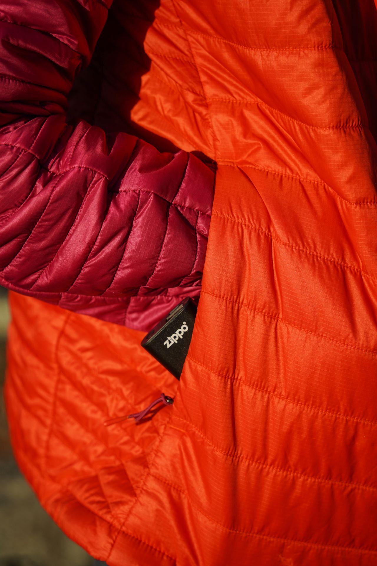 A zipper hand warmer in the pocket of a jacket.