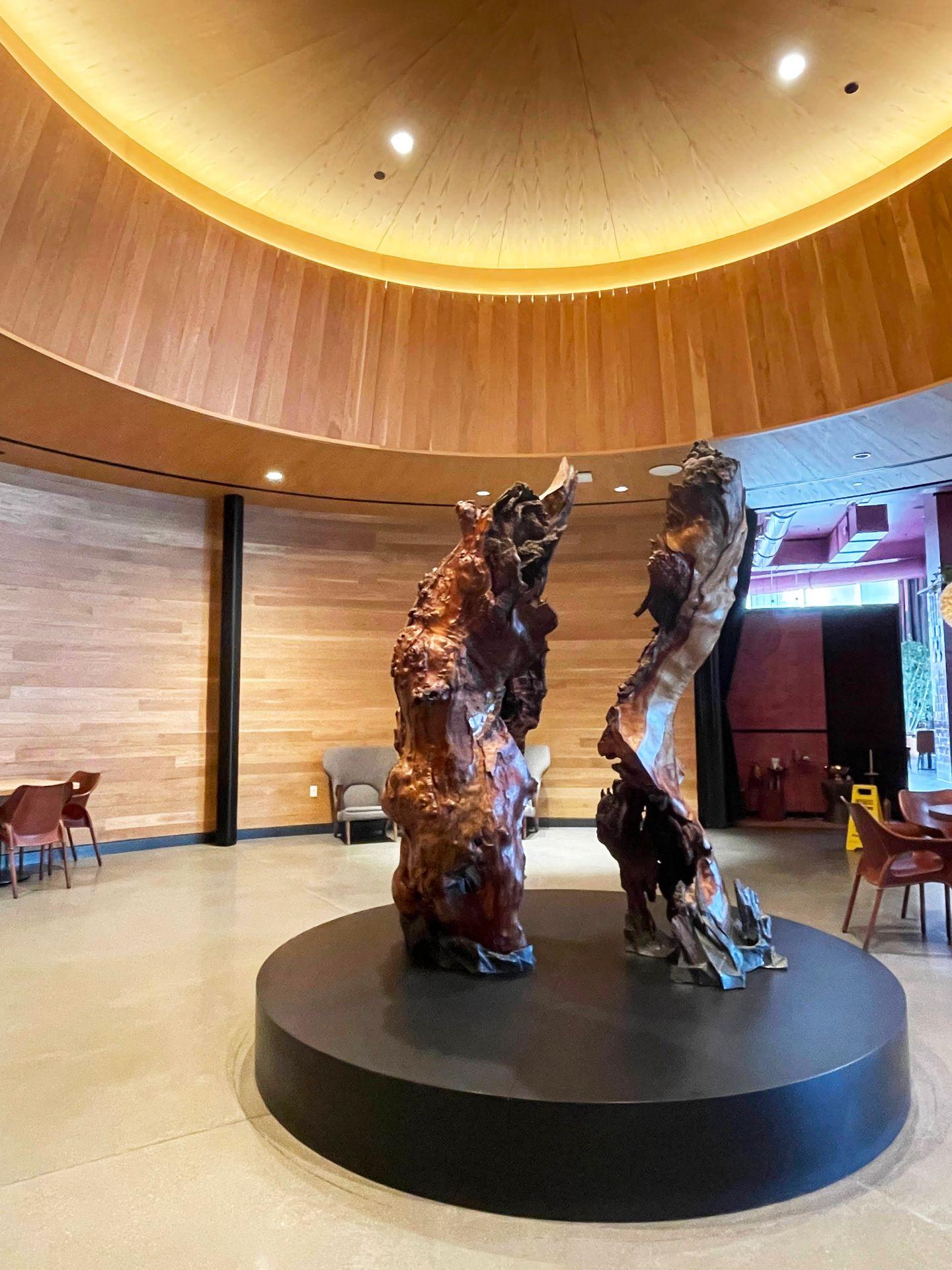 An abstract wooden sculpture in the lobby of Hotel Indigo.