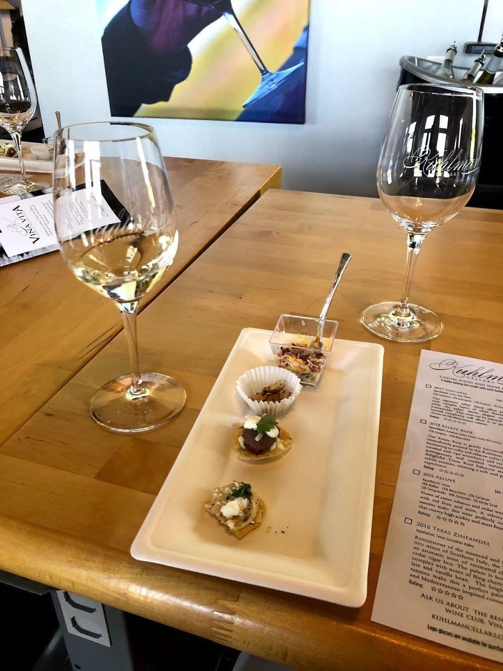 A plate with mini tastings next to some wine glasses at Kuhlan Cellars.