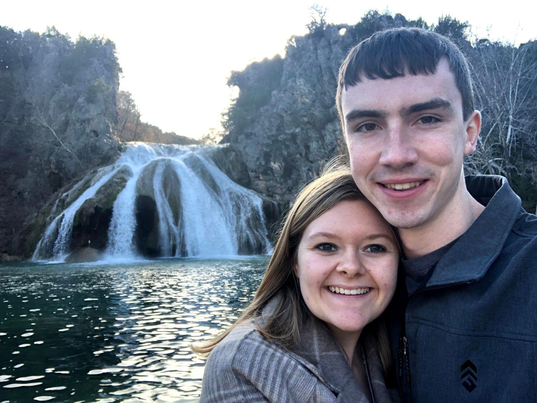 A selfie of Lydia and Joe in front of Turner Falls.
