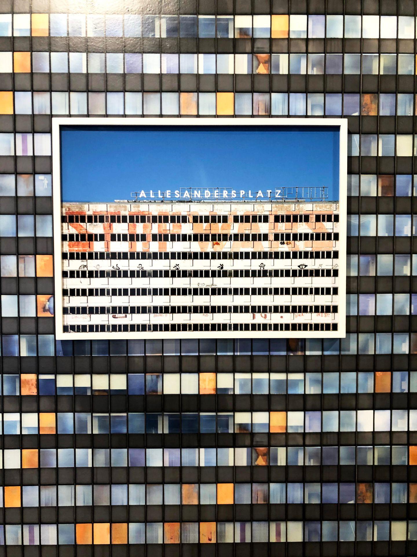 An architectural photograph haning on a wall that looks like a grid.