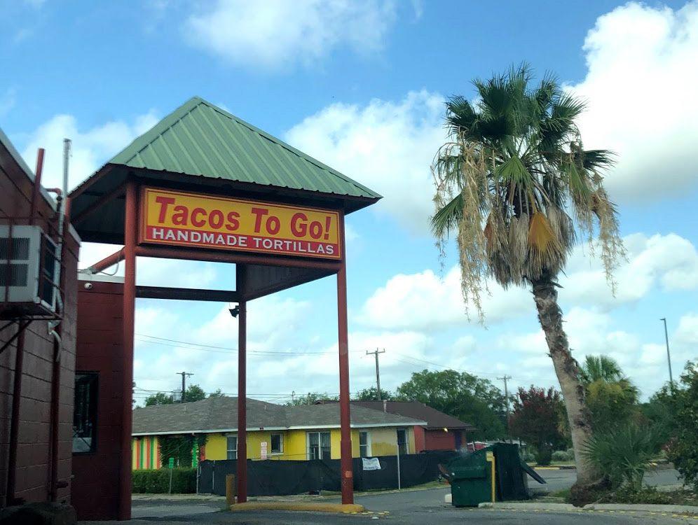 A sign reads 'Tacos To Go! Handmade Tortillas' at The Original Donut Shop Drive Thru.