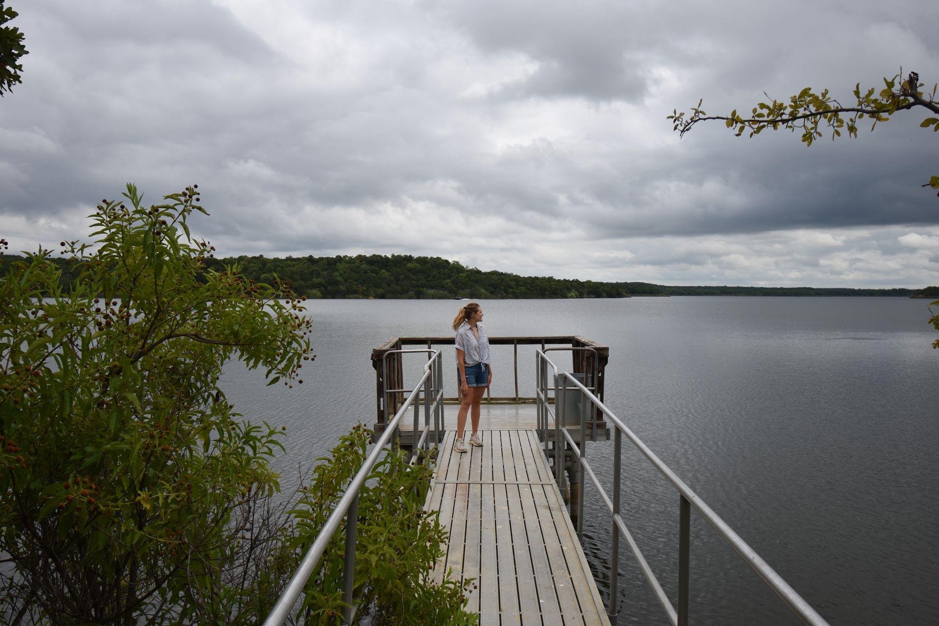 Lydia standing on a dock in Mineral Wells State Park.