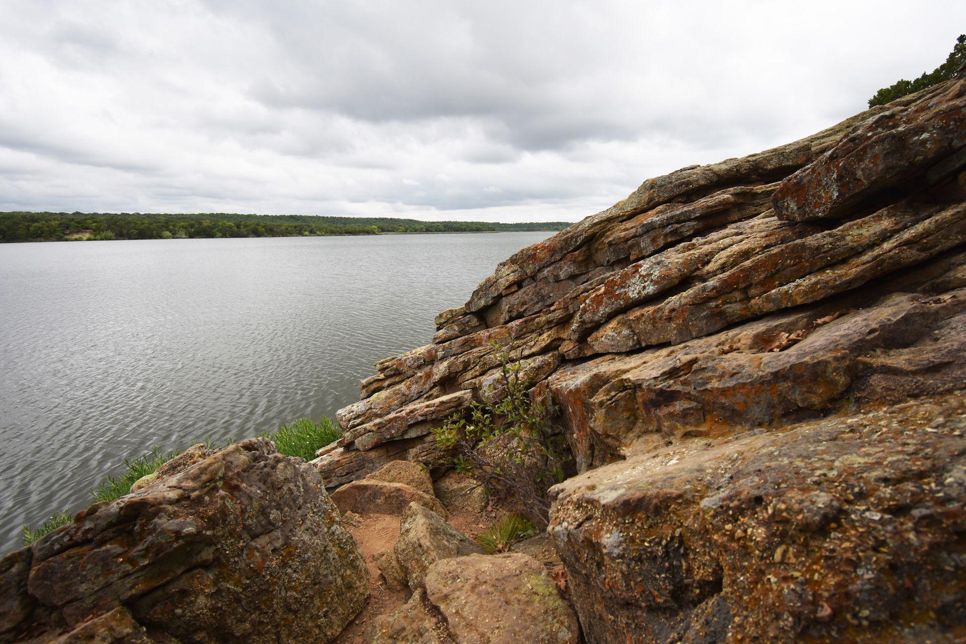 A view of rocks next to the river at Lake Mineral Wells State Park.