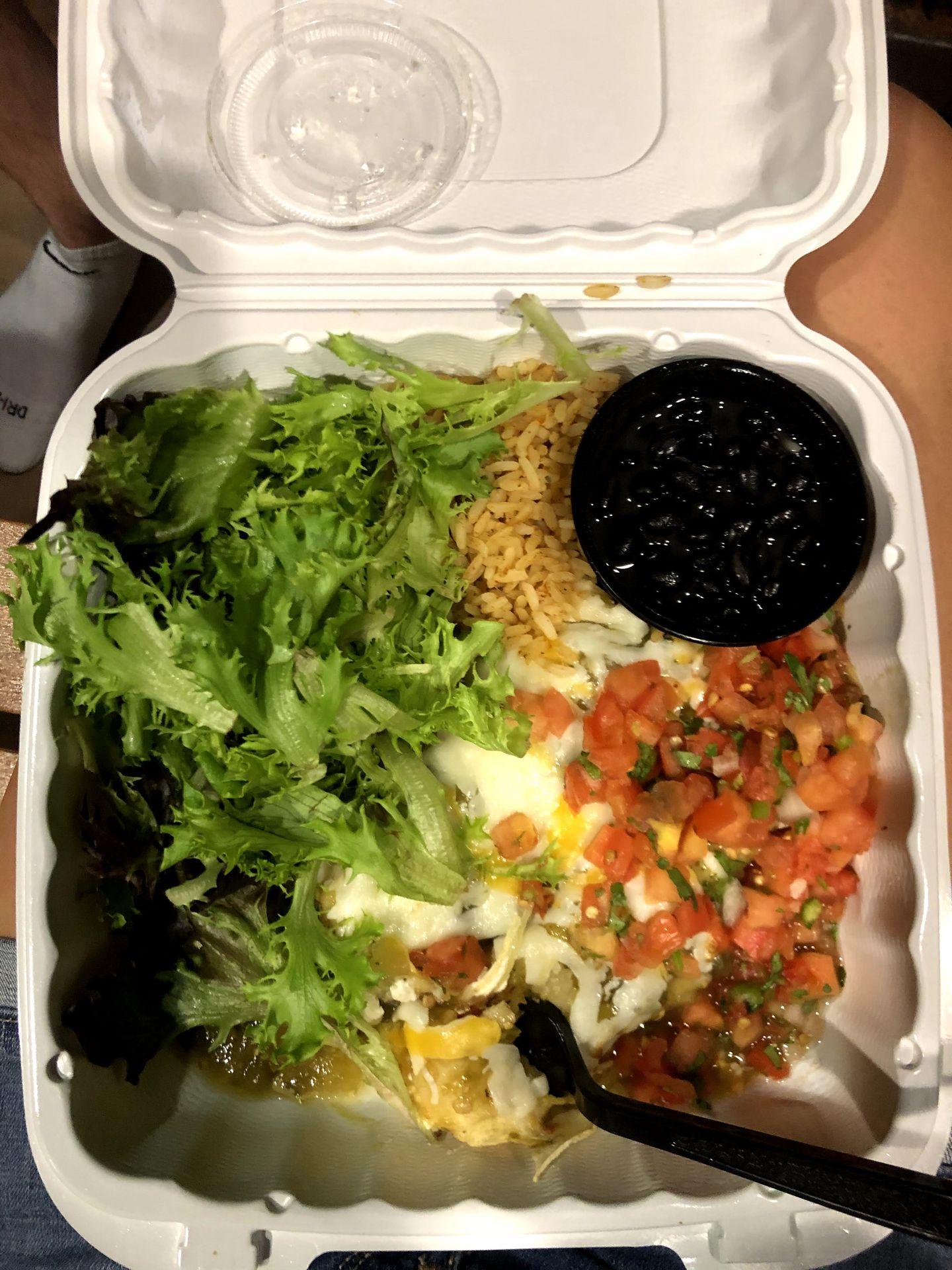 A take out box from Whiptail with Spaghetti Squash enchiladas.