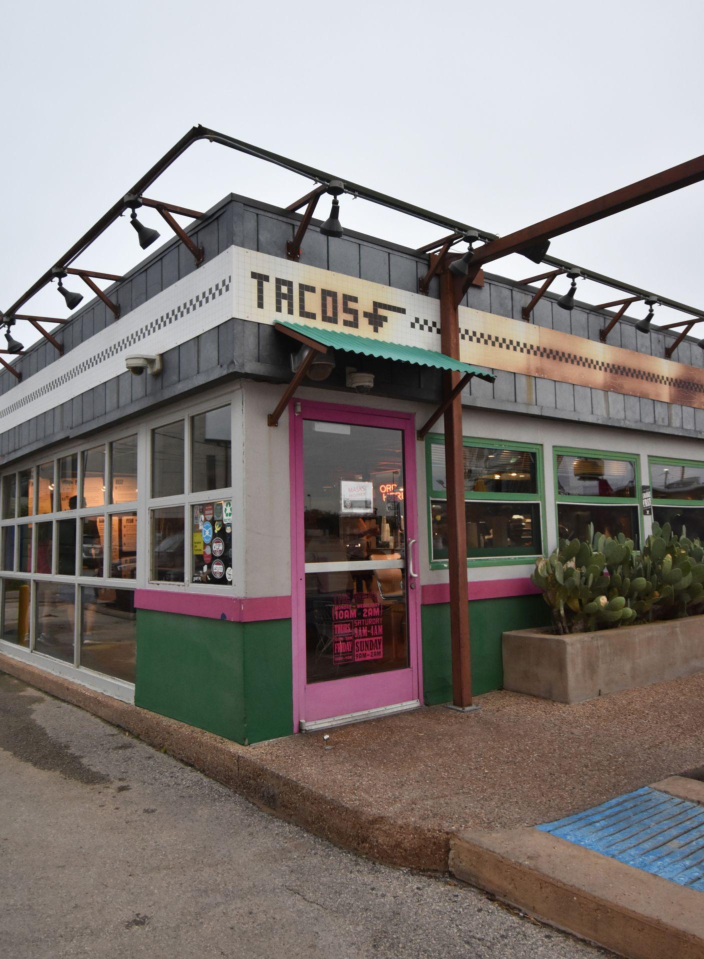 The exterior of Velvet Taco on N Henderson Ave. The word "Tacos" is above the door with an arrow pointing down.