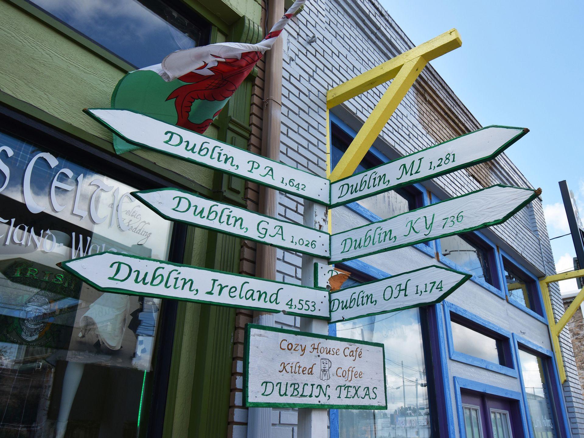 A sign post that lists the milage to Dublin, Ireland, Dublin, OH, Dublin, KY and other cities named Dublin in the US.