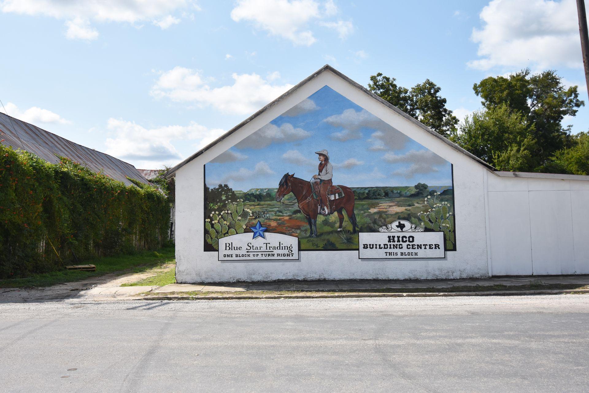 A mural in Hico with a cowboy on a horse.