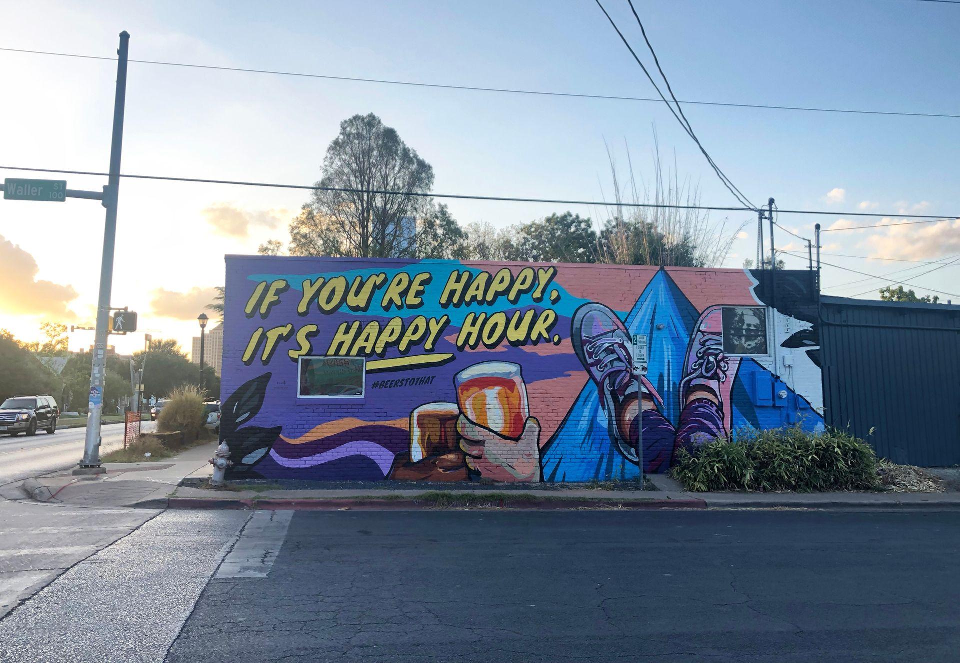 An East Austin mural that reads "If you're happy, it's happy hour"