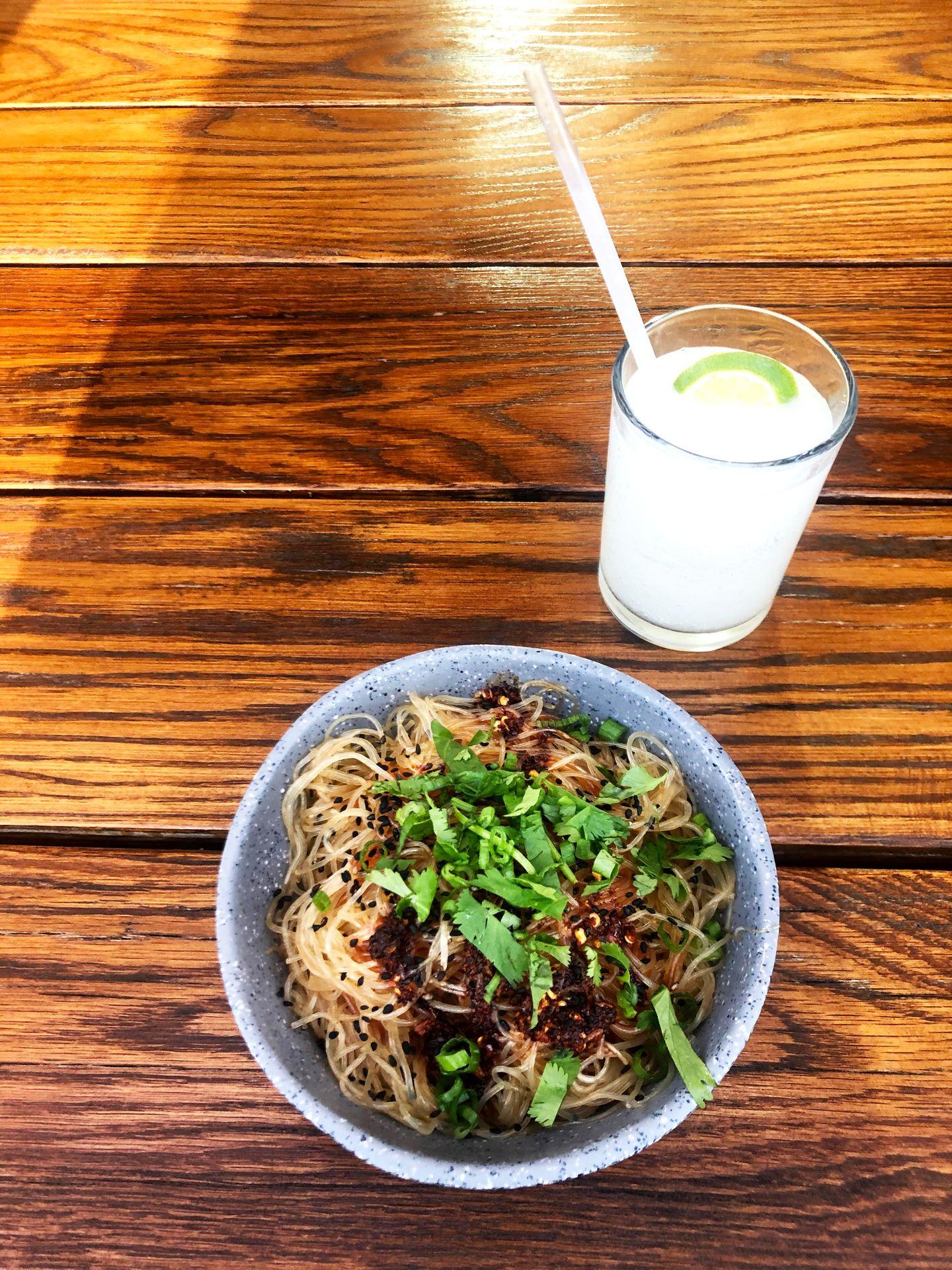 A noodle bowl and margarita from Loro.