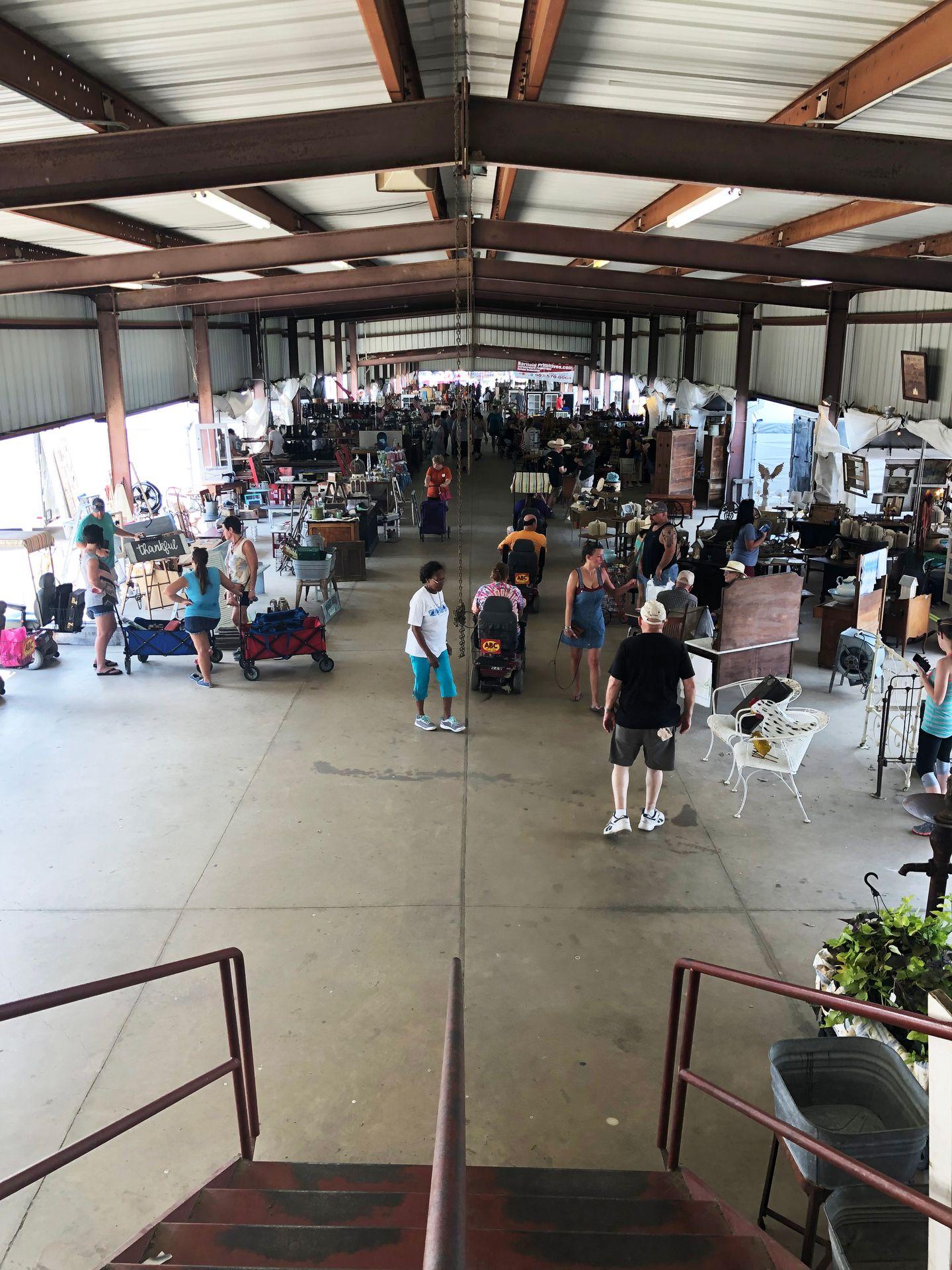 Looking down at a large hall in the Canton First Mondays flea market.