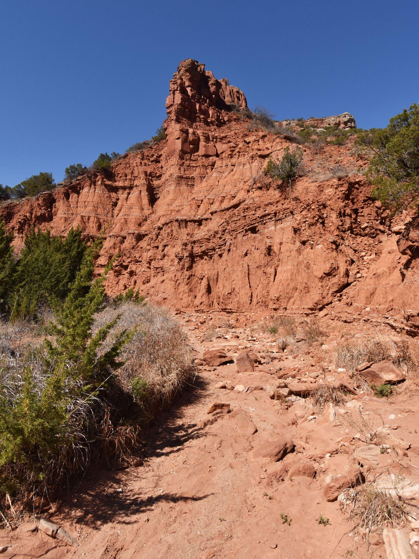 An orange rock formation that resembles a castle on the Upper North Prong trail.