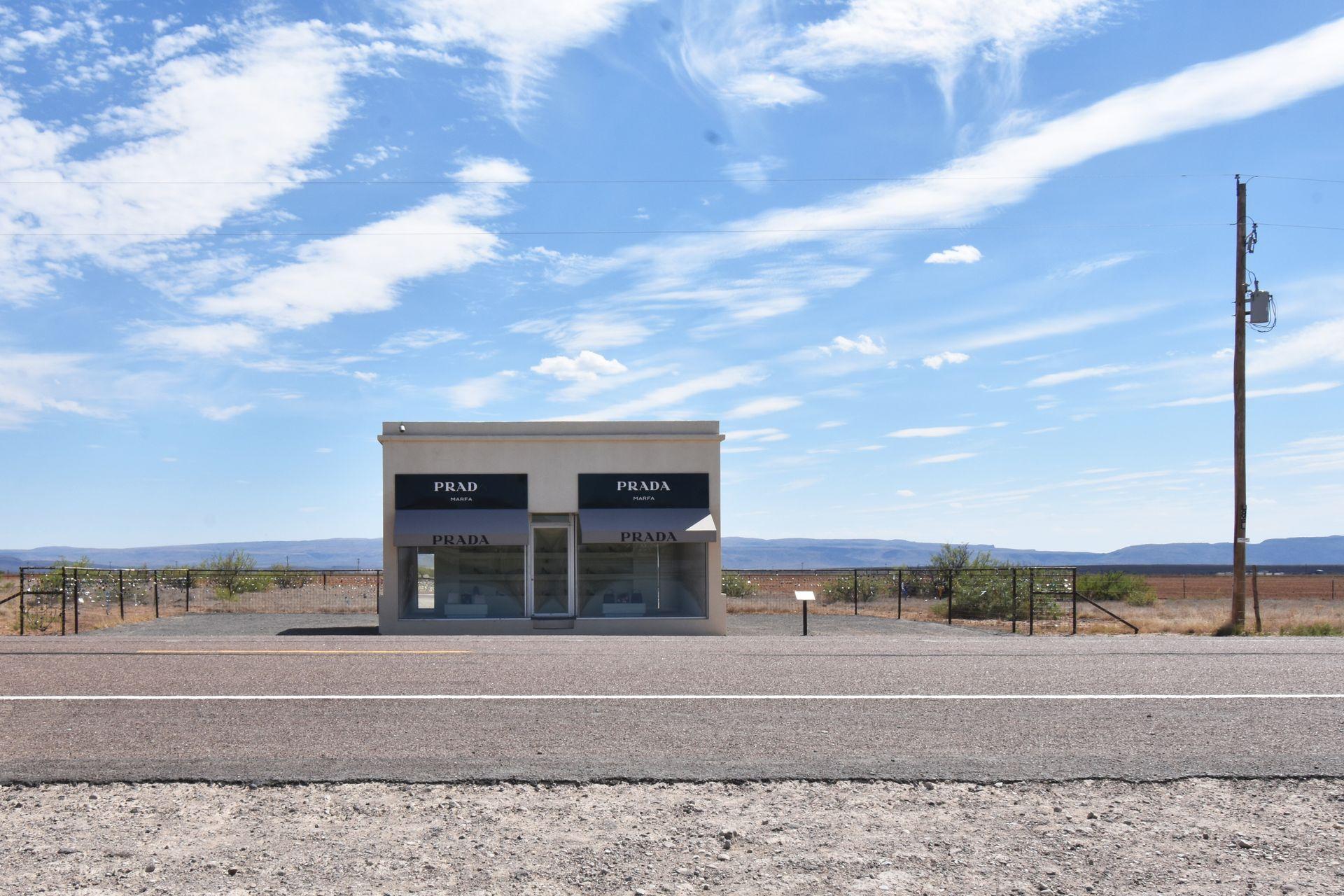 Looking across the street at Prada Marfa with an expansive desert in the background.