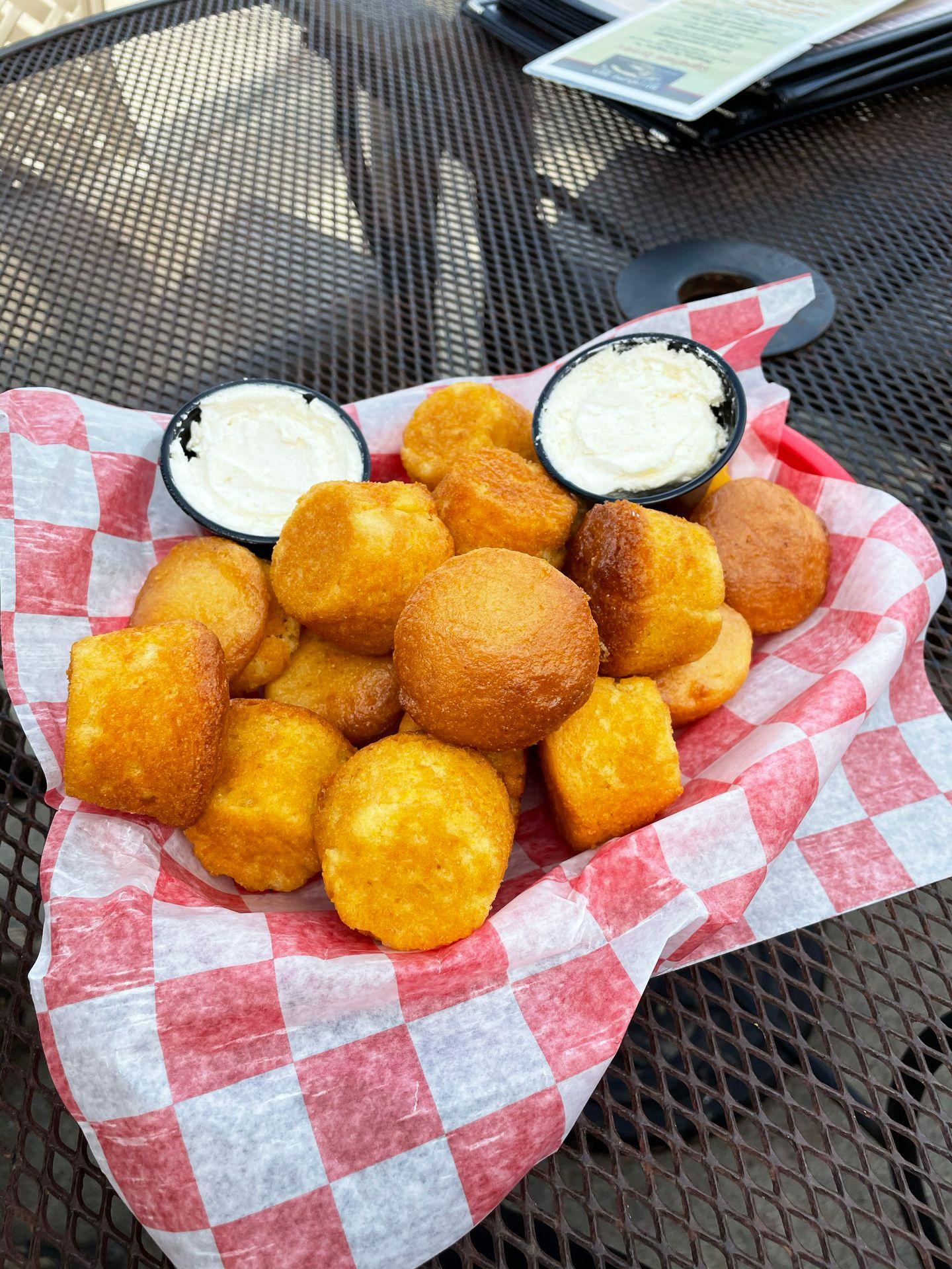 A basket of small cornbread muffins from Millstone  BBQ