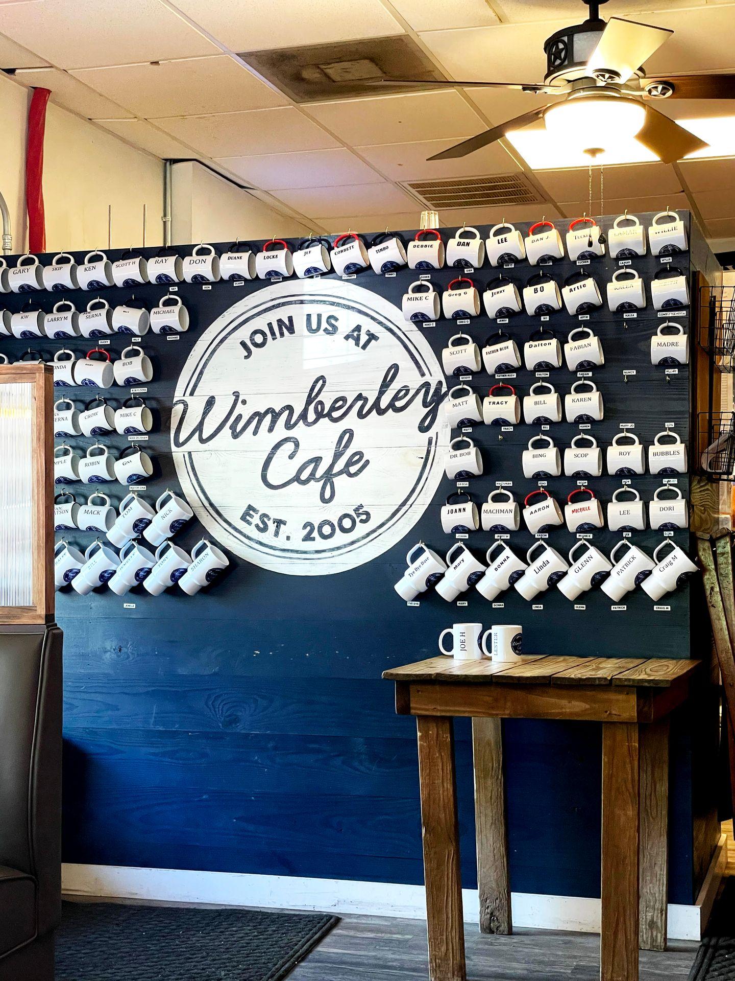 A wall of coffee mugs at Wimberley Cafe.