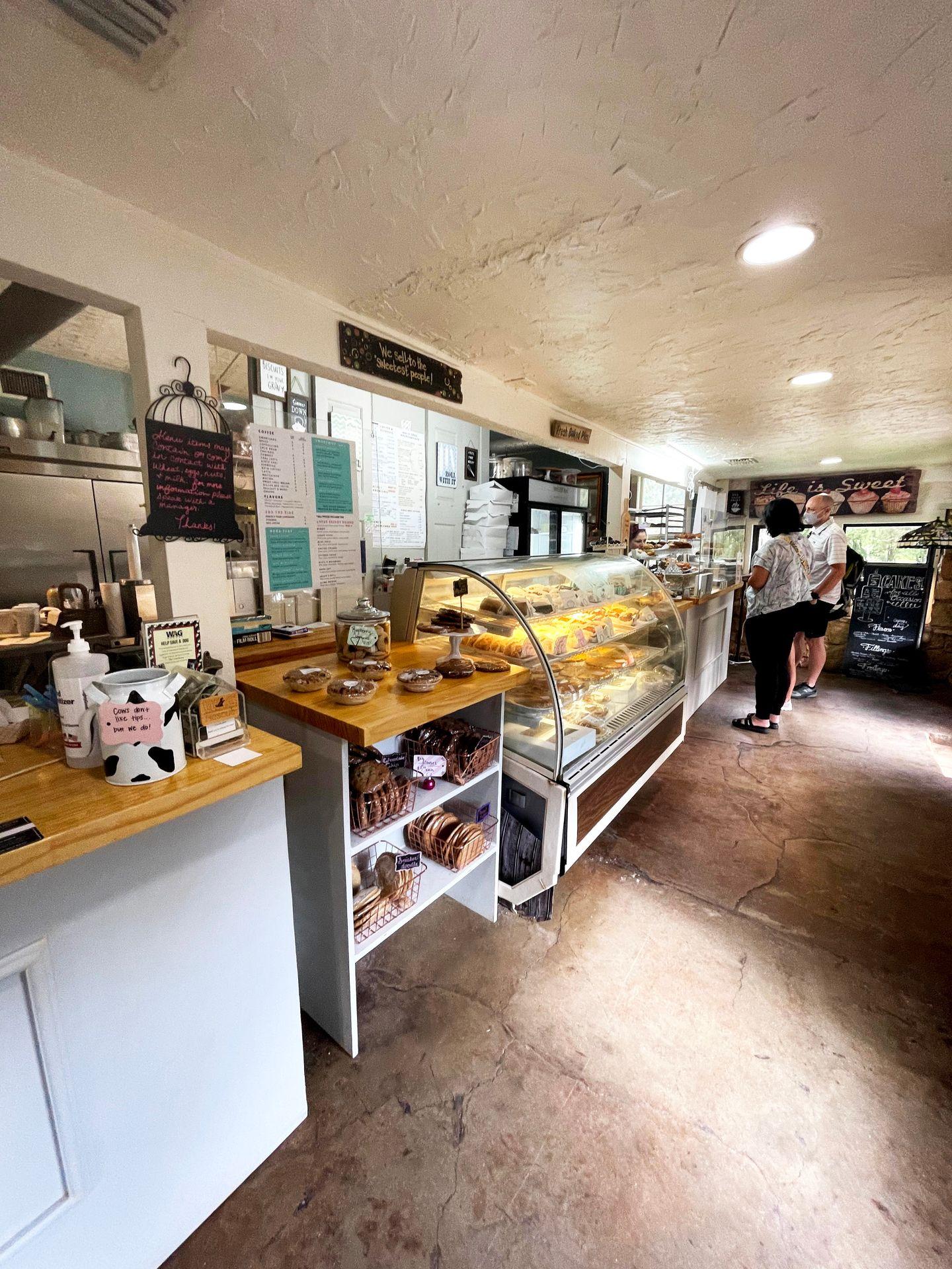 The inside of Sugar Shack Bakery, where there is a display case full of pastries.