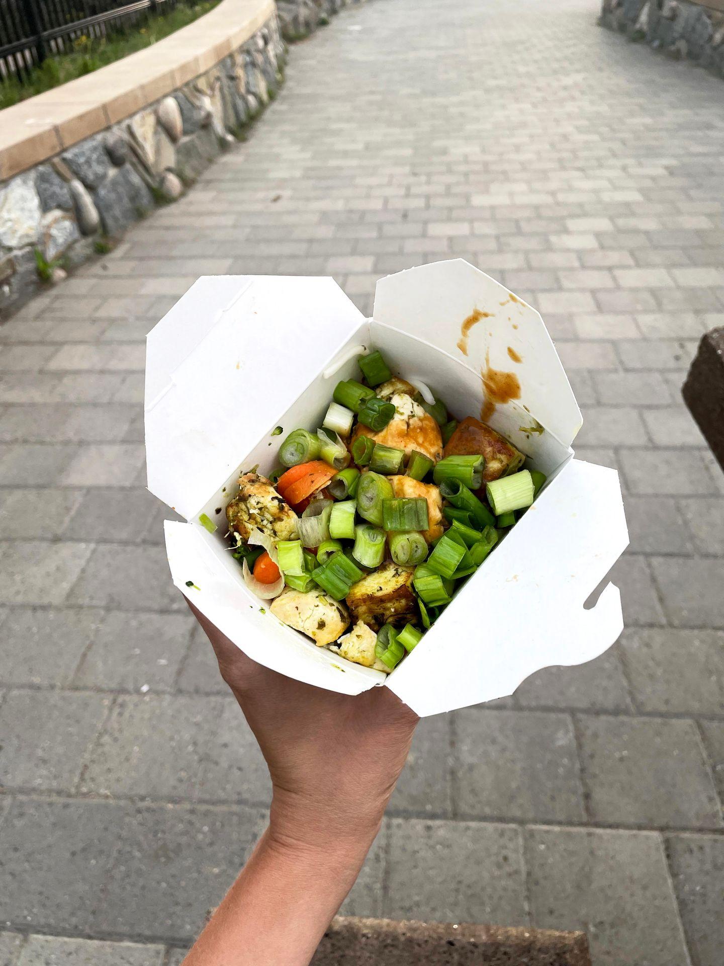 A to-go container of wok noodles from the Canyon Eatery.