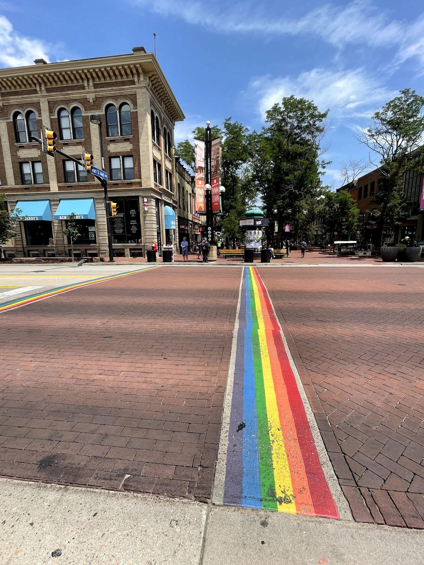 A rainbow road crossing in downtown Boulder.