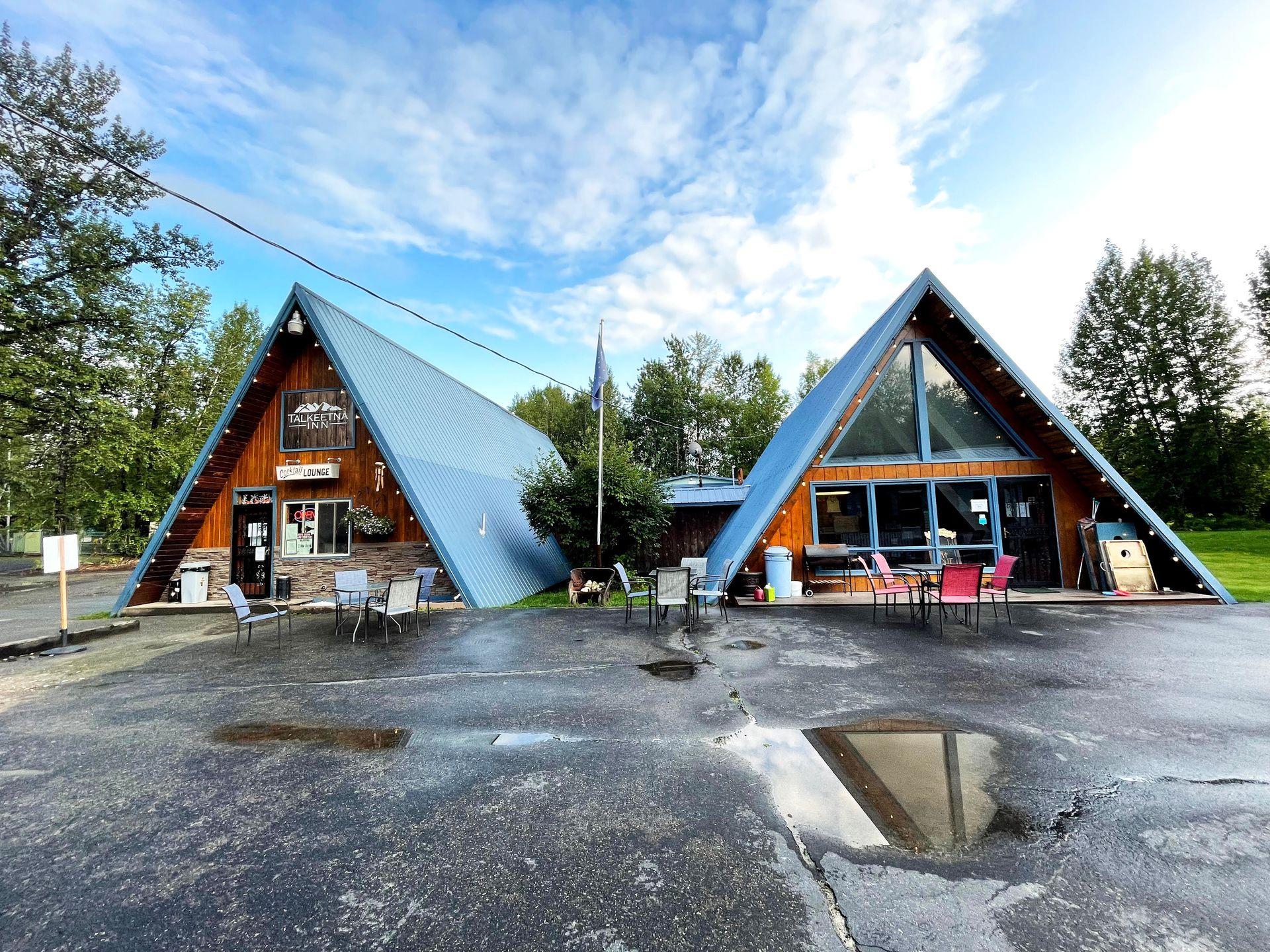 Two A-Frame buildings that make up the offices of the Talkeetna Inn.
