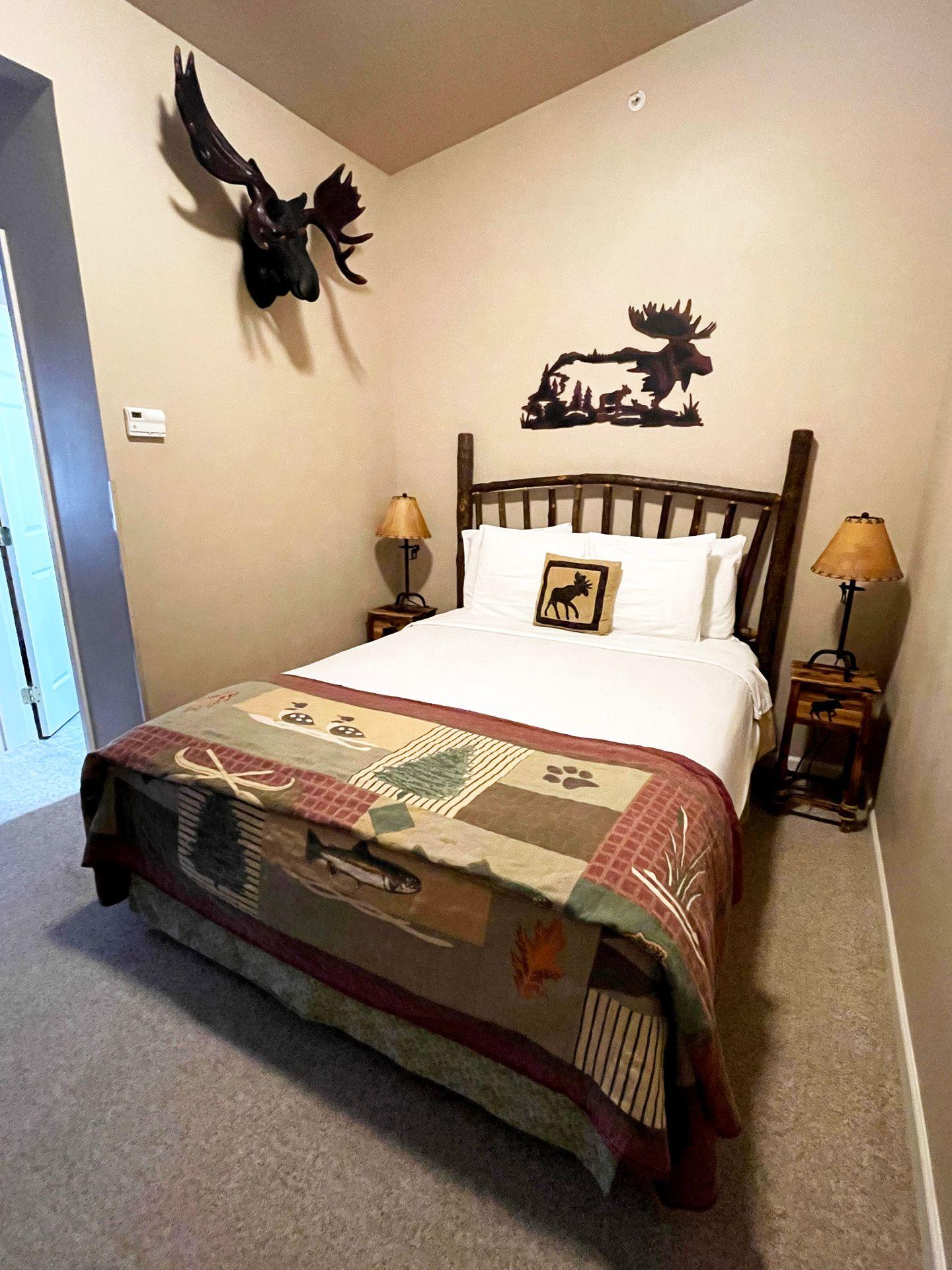A bed in a room at the Buffalo Run Inn