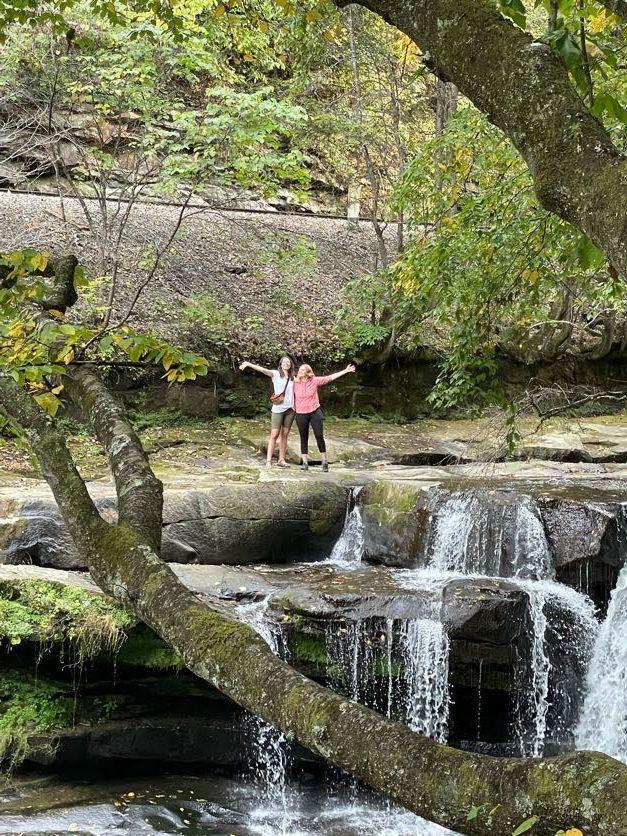 Lydia and a friend standing above Dunlop Creek Falls.