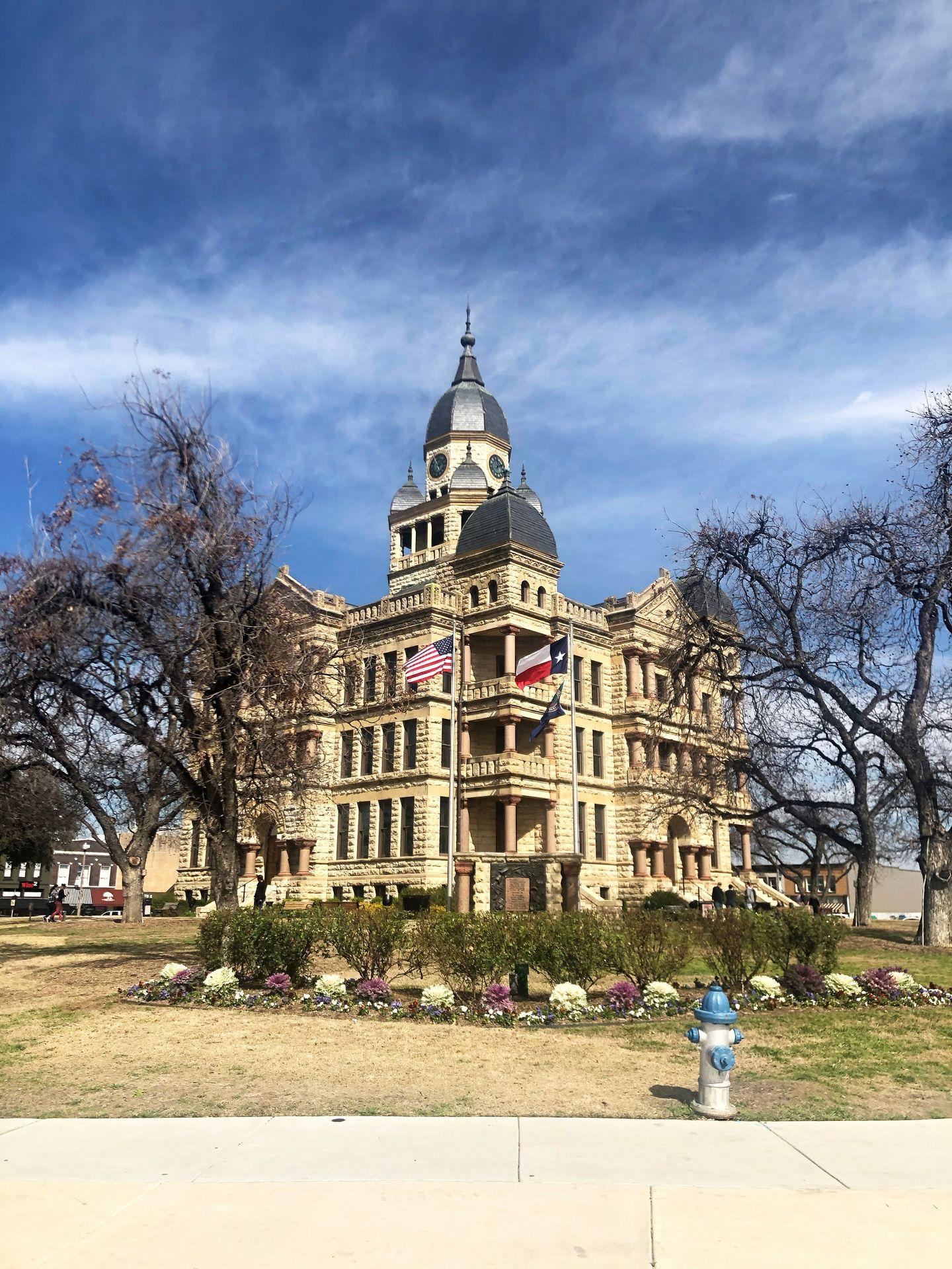 A photo of the Denton Courthouse in the Denton Downtown Square.