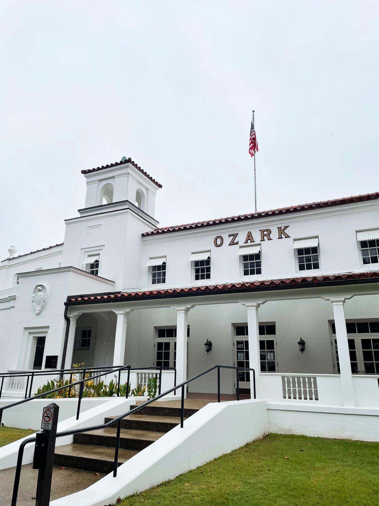The historic Ozark bathhouse, which is a white art deco style building that now houses the Hot Springs National Park Cultural Center