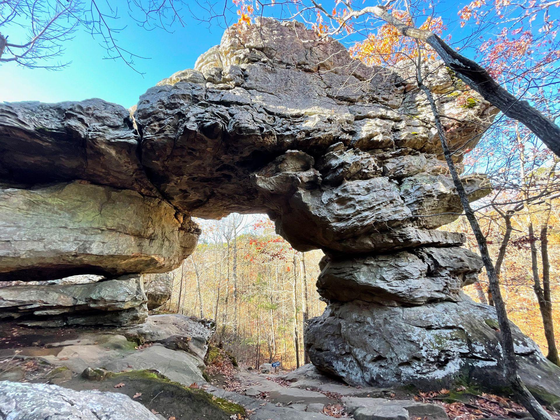 A giant rock arch on the Seven Hollows trail. You can walk through the wide arch.